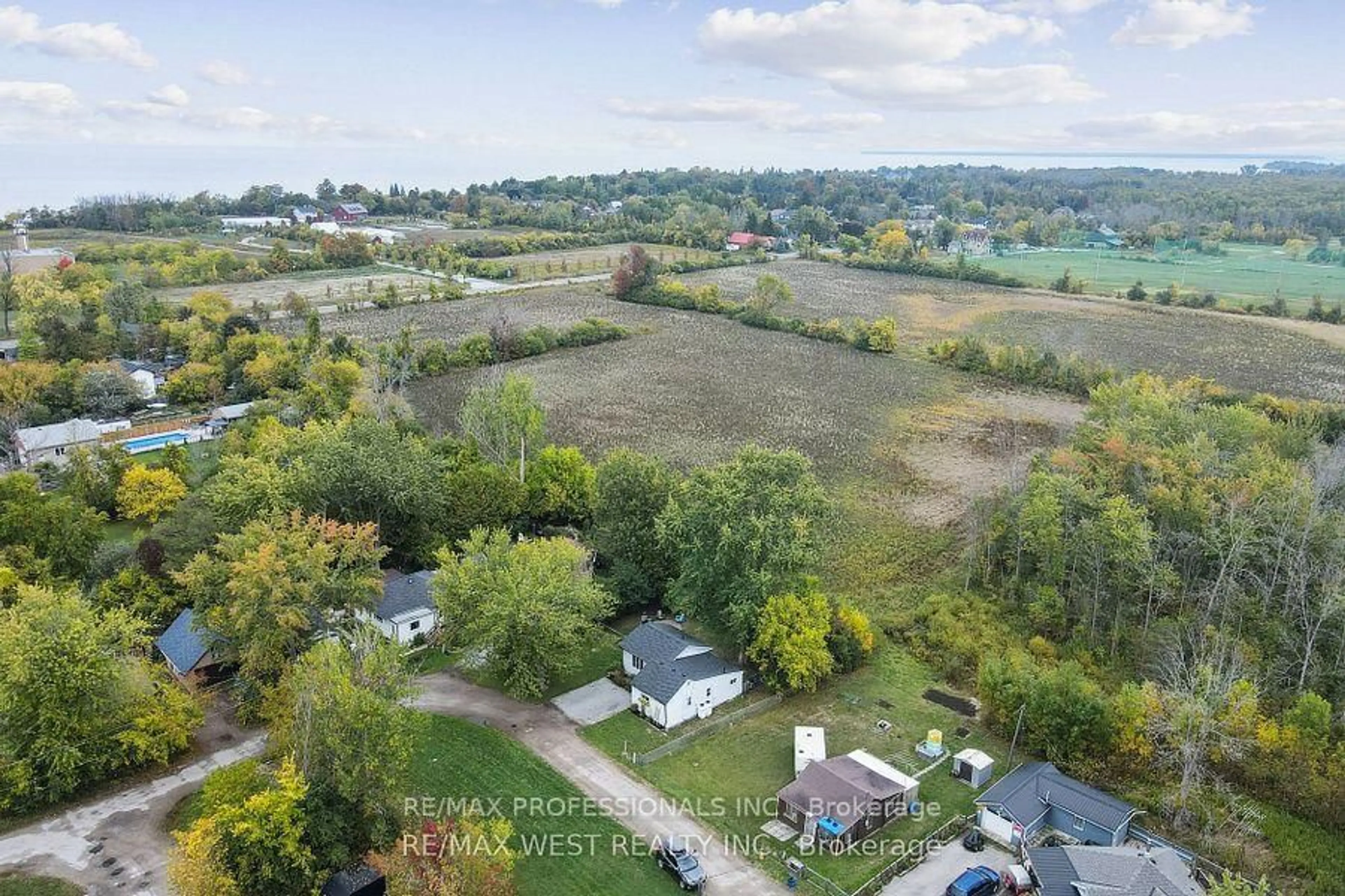 A pic from outside/outdoor area/front of a property/back of a property/a pic from drone, water/lake/river/ocean view for 14 Patty Lane, Georgina Ontario L5E 1S0