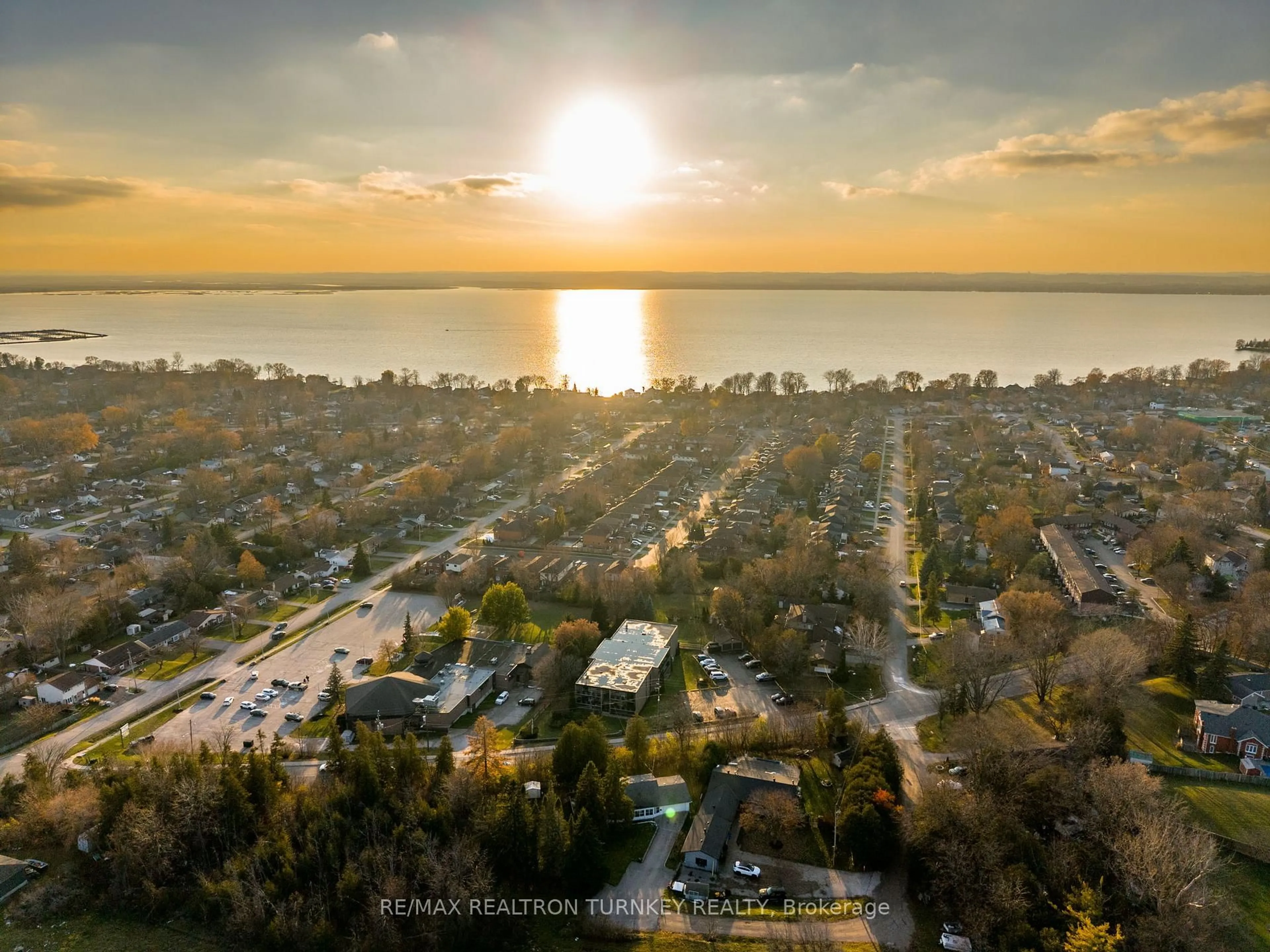 A pic from outside/outdoor area/front of a property/back of a property/a pic from drone, water/lake/river/ocean view for 74 The Queensway #102, Georgina Ontario L4P 1Z3