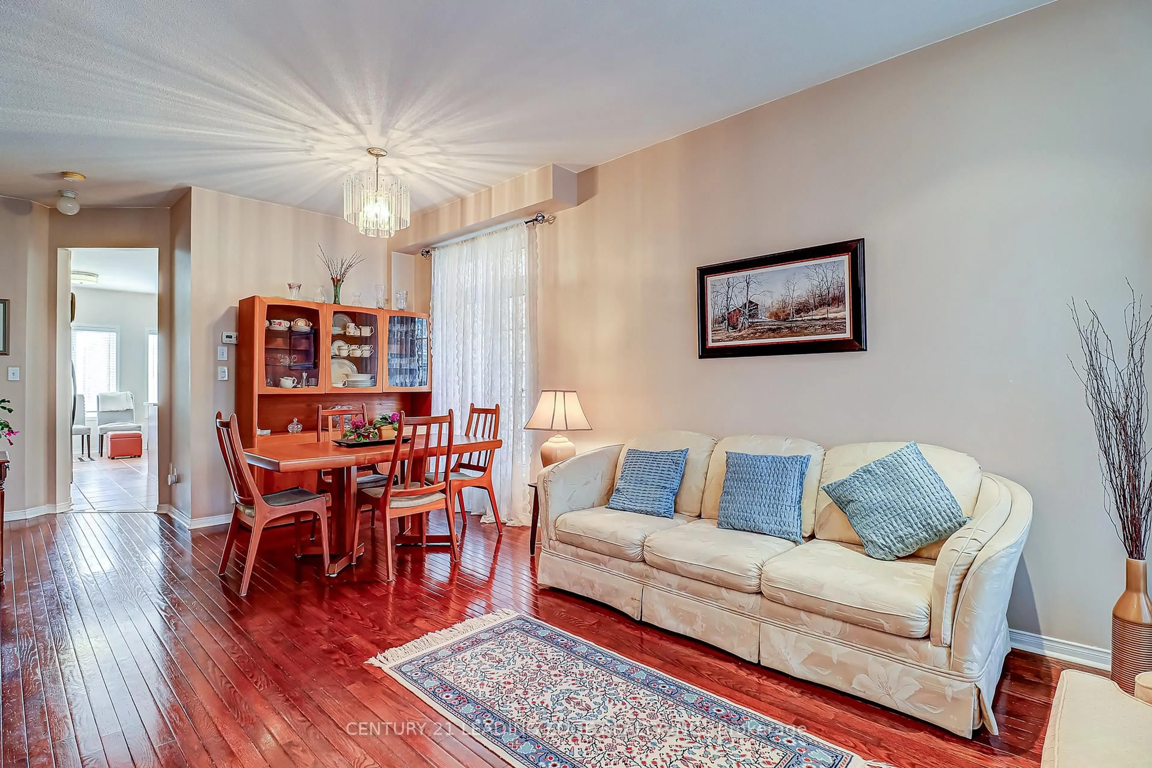 Living room with furniture, wood/laminate floor for 157 Stalmaster Rd, Markham Ontario L6E 0A1