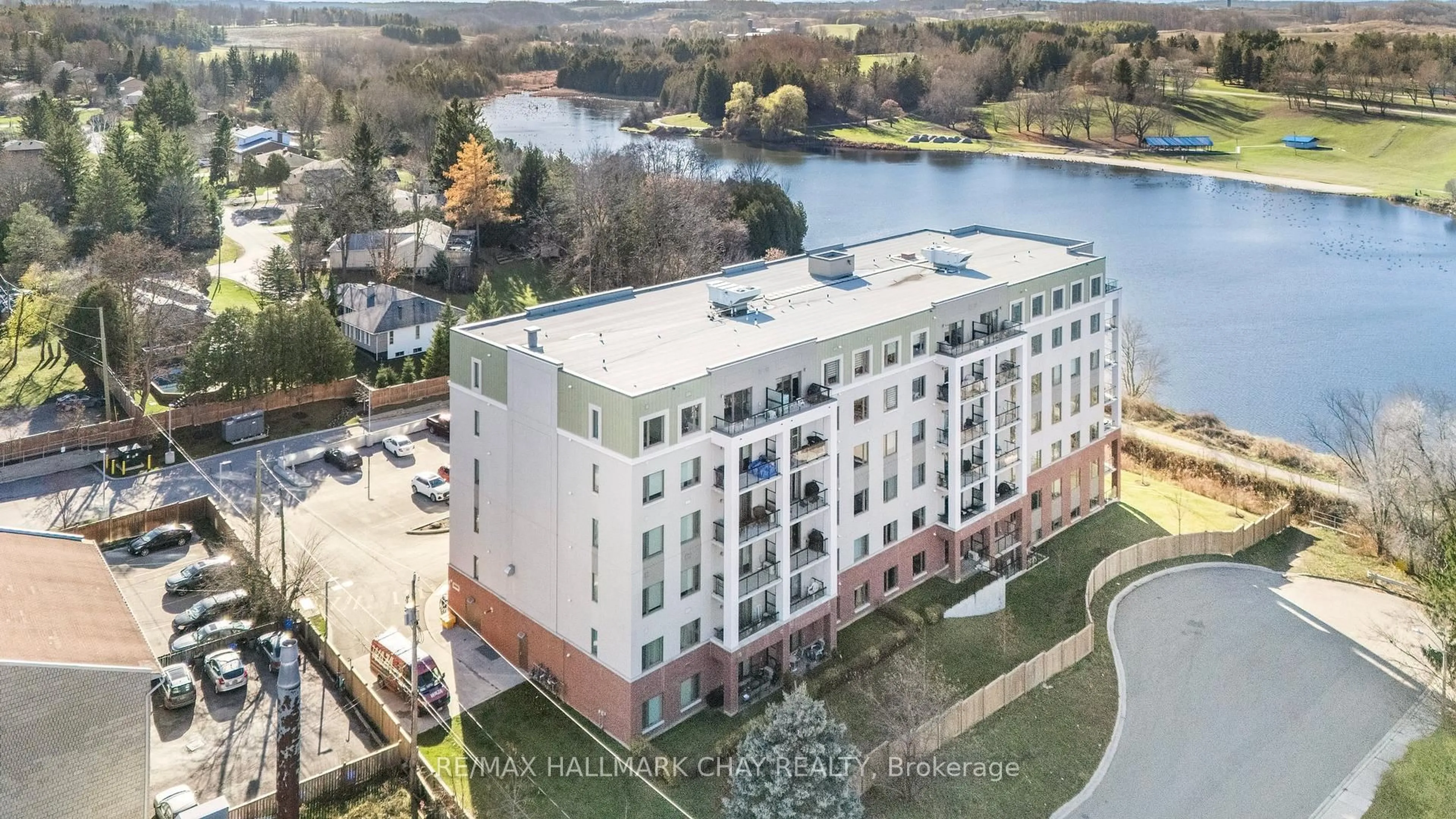 A pic from outside/outdoor area/front of a property/back of a property/a pic from drone, water/lake/river/ocean view for 64 Queen St #107, New Tecumseth Ontario L0G 1W0