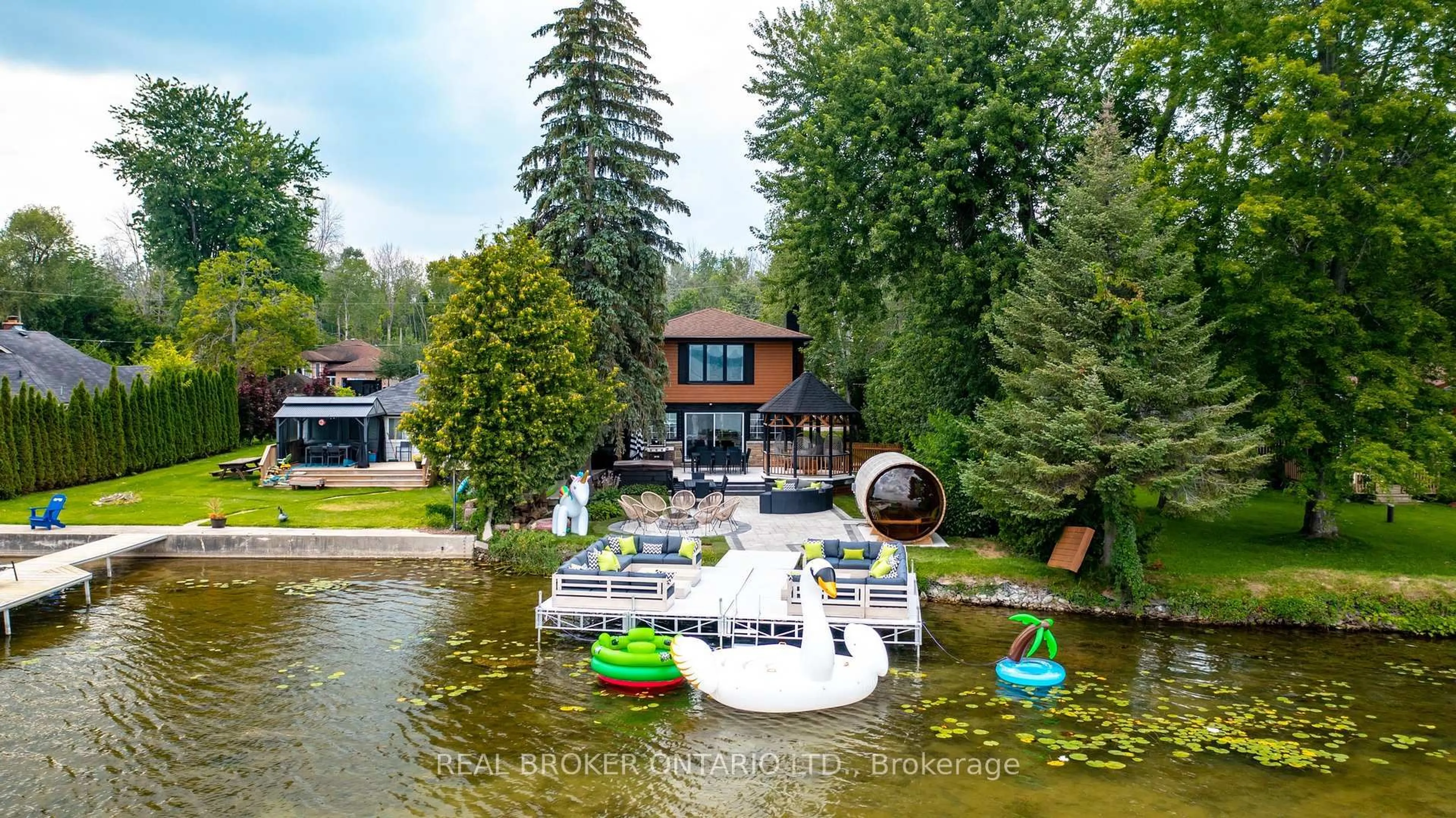A pic from outside/outdoor area/front of a property/back of a property/a pic from drone, water/lake/river/ocean view for 943 Barry Ave, Innisfil Ontario L0L 1W0