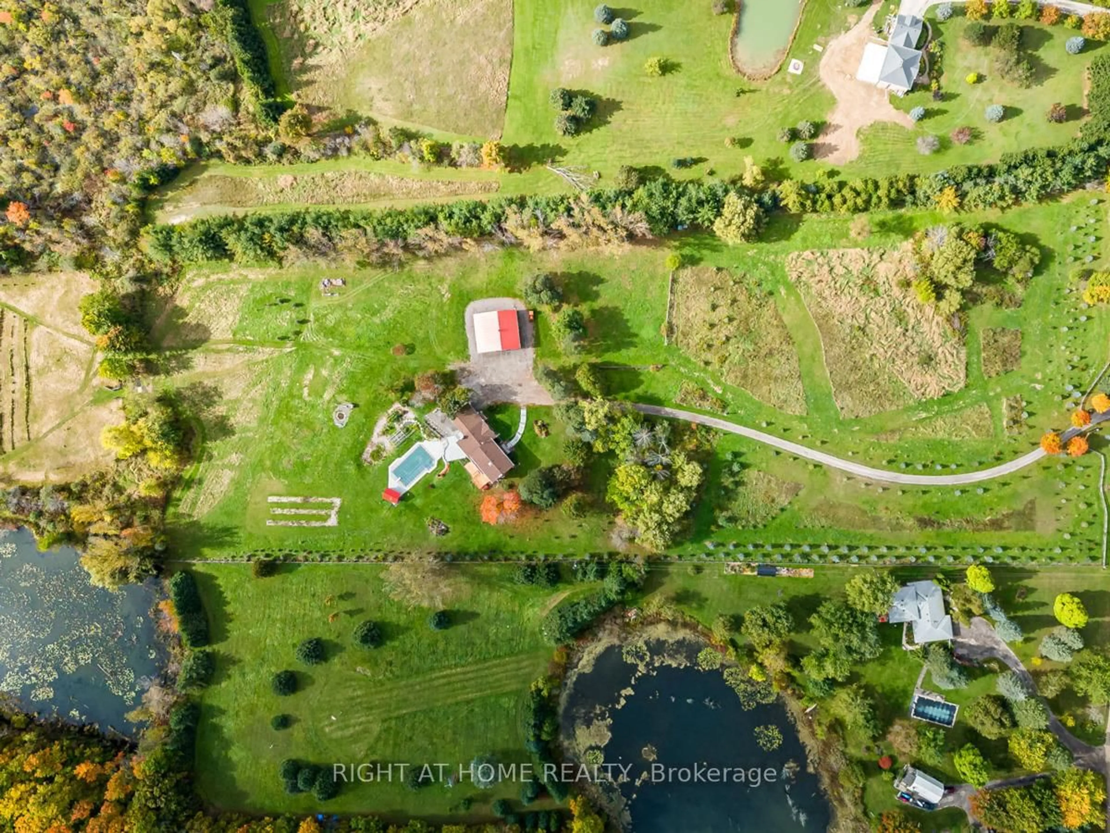 A pic from outside/outdoor area/front of a property/back of a property/a pic from drone, water/lake/river/ocean view for 7975 18th Sdrd, King Ontario L0G 1T0