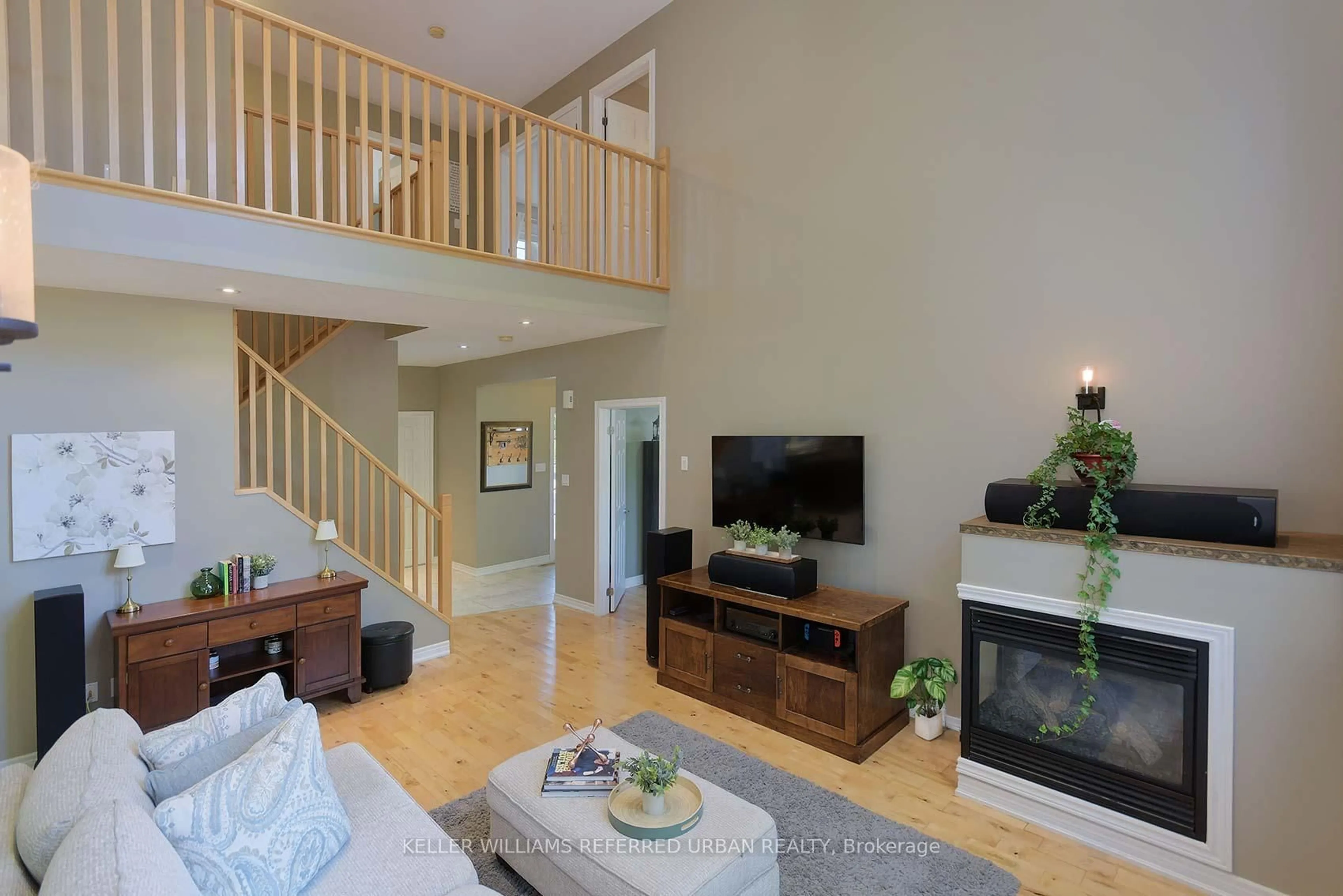 Living room with furniture, wood/laminate floor for 995 Chapman St, Innisfil Ontario L0L 1W0