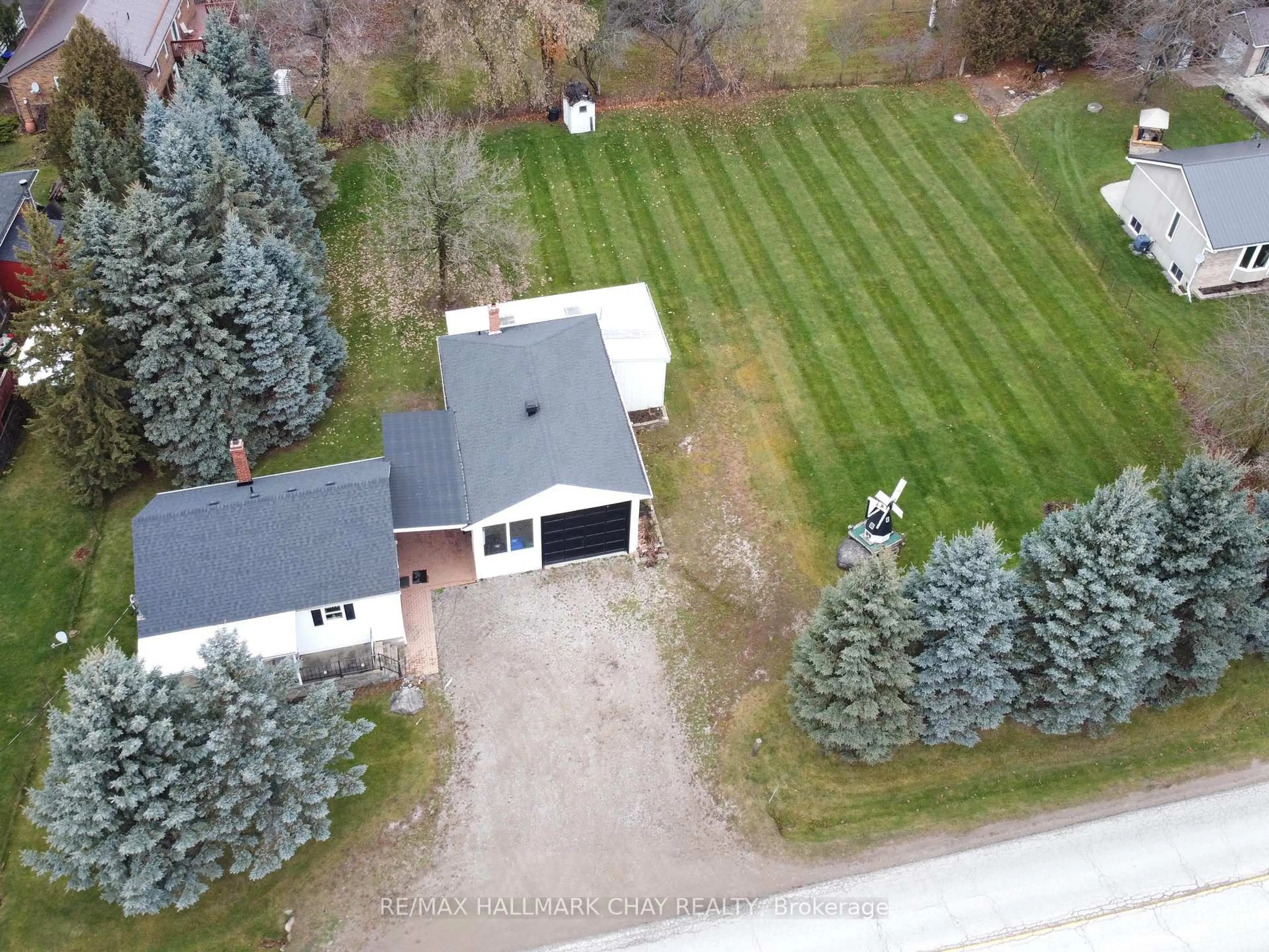 A pic from outside/outdoor area/front of a property/back of a property/a pic from drone, street for 5070 5th Line, New Tecumseth Ontario L0G 1W0