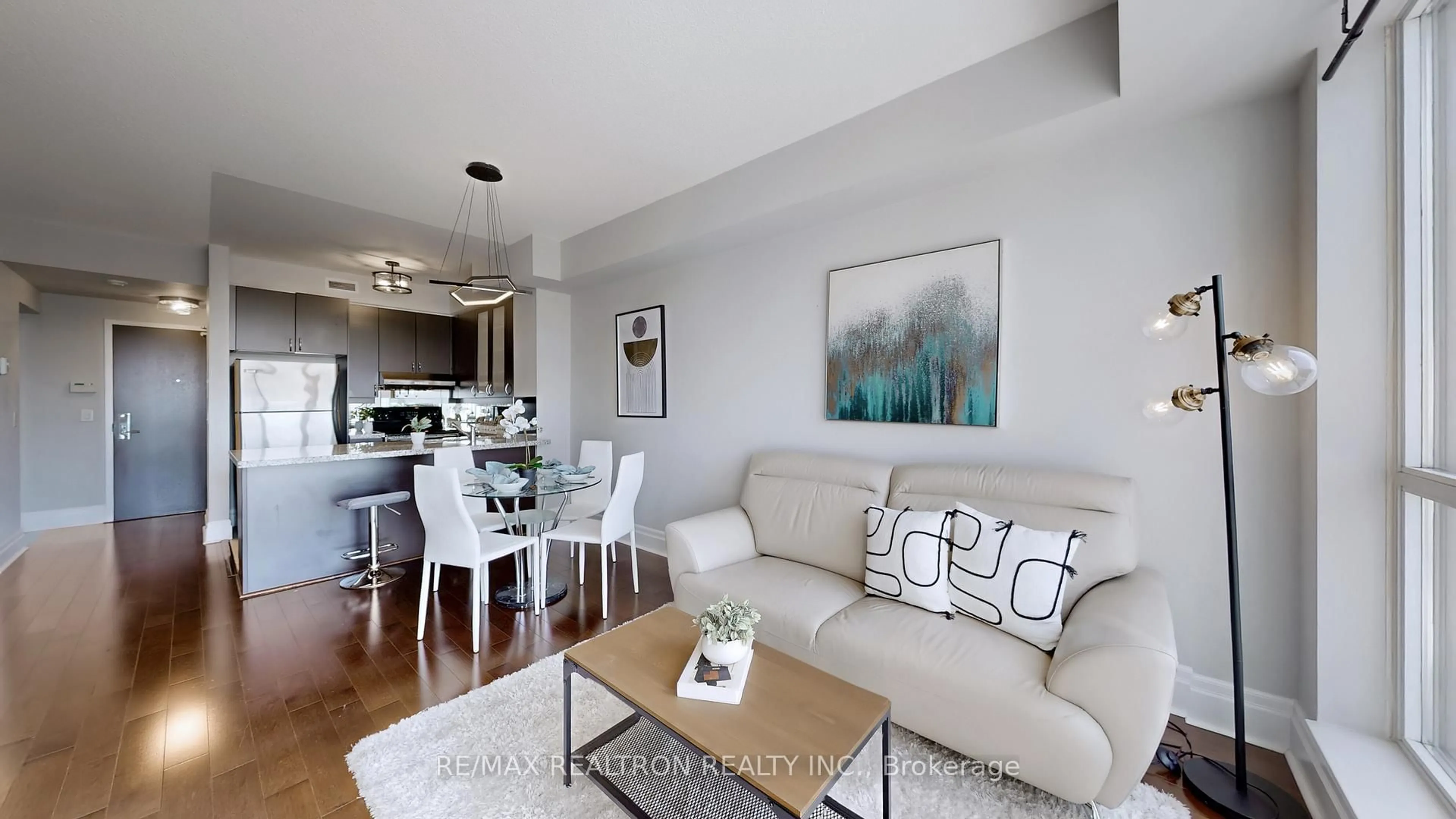 Living room with furniture, wood/laminate floor for 39 Upper Duke Cres #413, Markham Ontario L6G 0B8