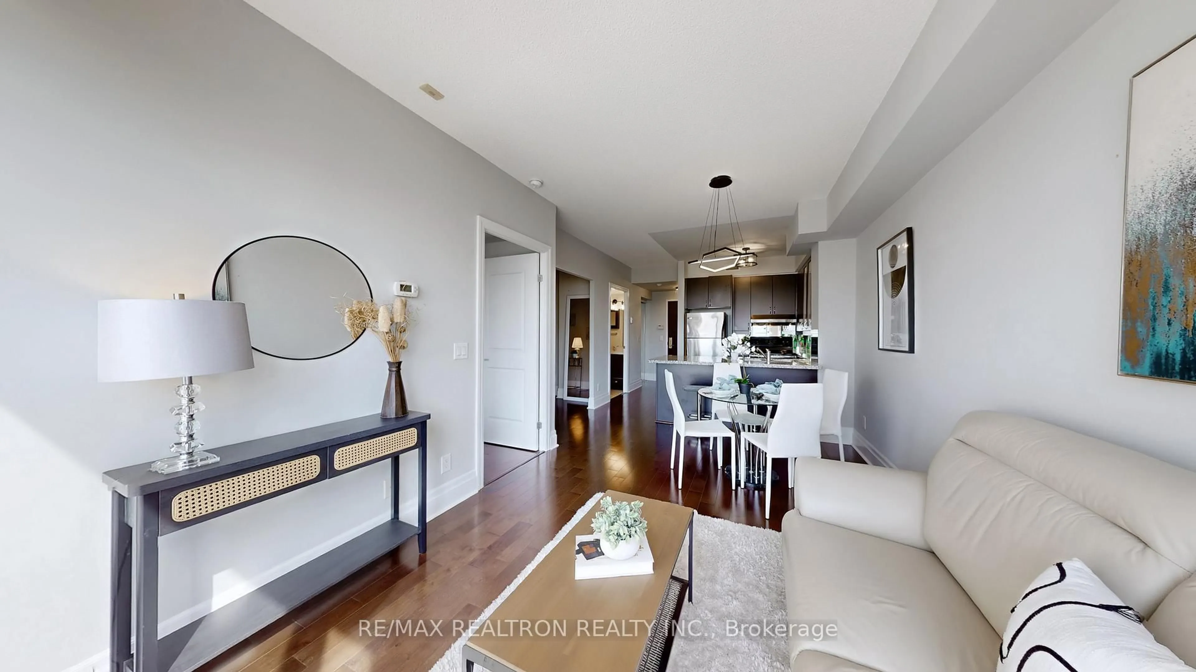 Living room with furniture, wood/laminate floor for 39 Upper Duke Cres #413, Markham Ontario L6G 0B8