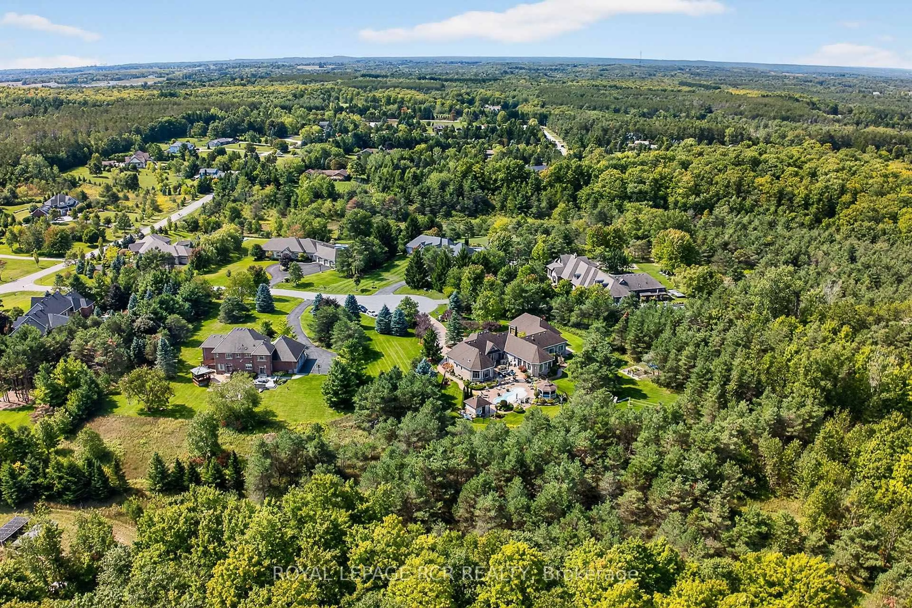 A pic from outside/outdoor area/front of a property/back of a property/a pic from drone, forest/trees view for 7 Sugarbush Lane, Uxbridge Ontario L9P 2A1