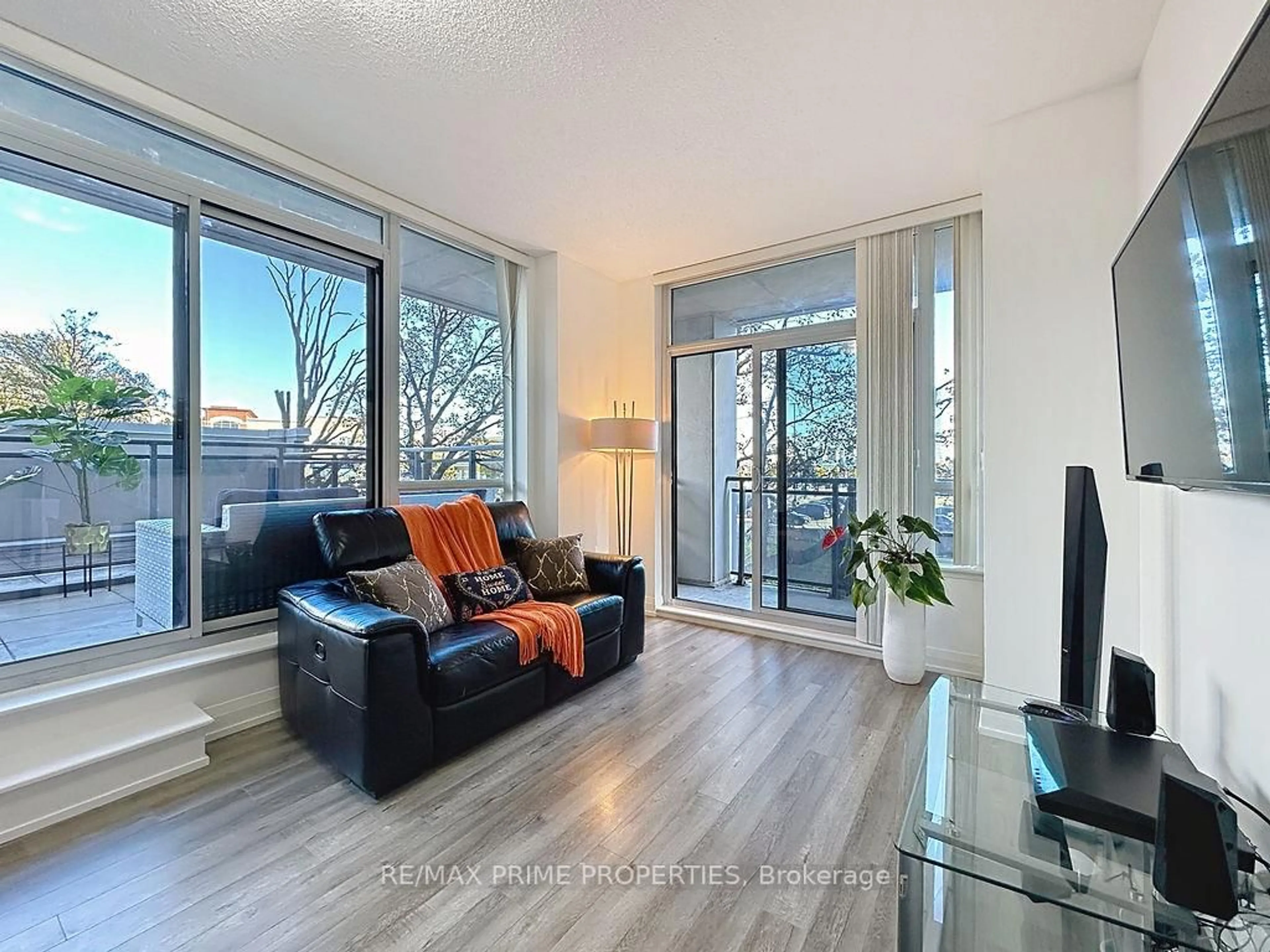 Living room with furniture, wood/laminate floor for 85 North Park Rd #205, Vaughan Ontario L4J 0H9