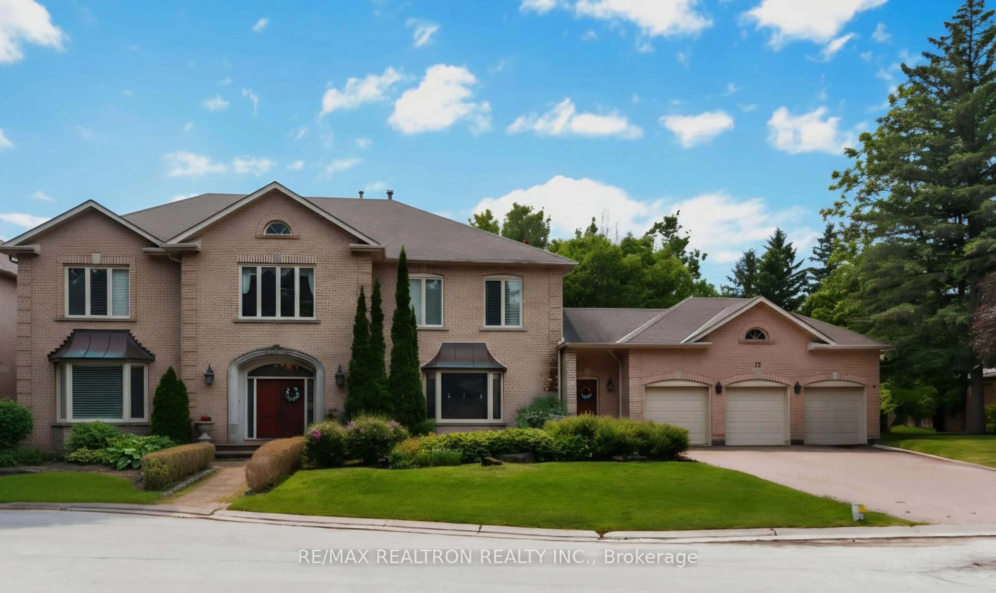 Home with brick exterior material, street for 12 Moodie Dr, Richmond Hill Ontario L4C 8C9