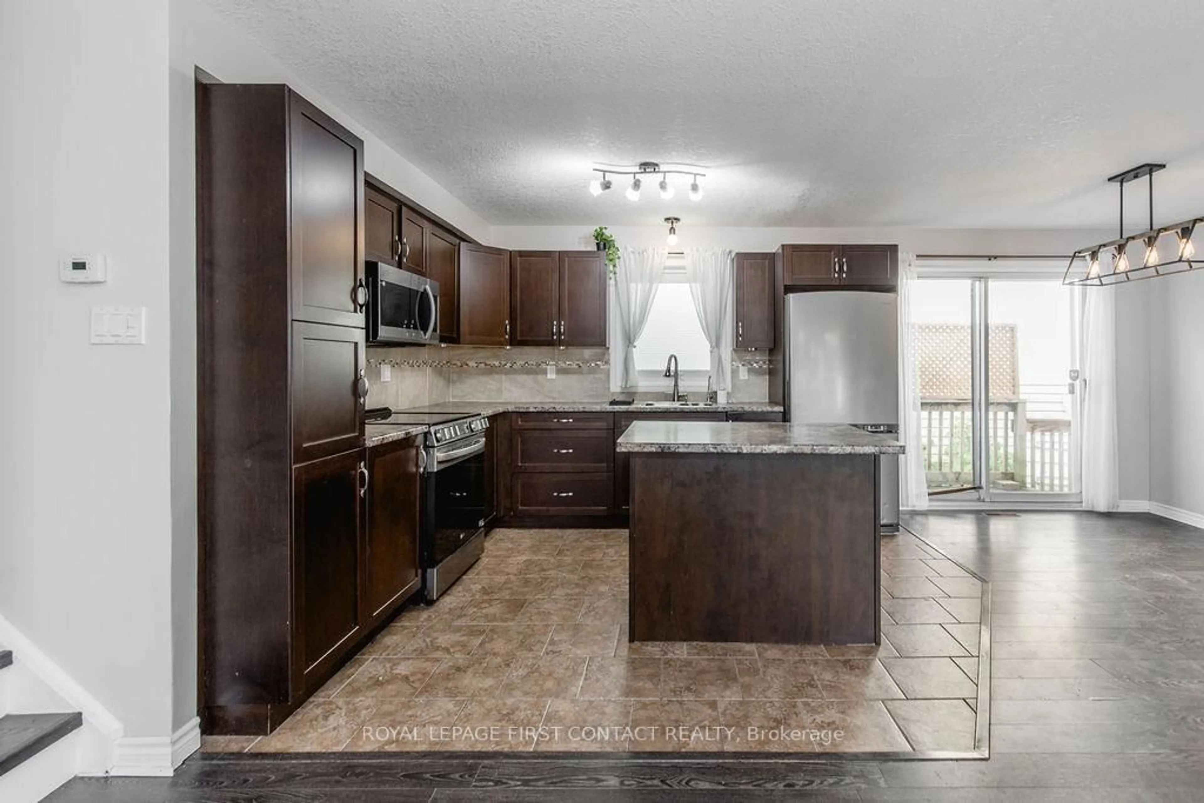 Open concept kitchen, ceramic/tile floor for 6 Duckworth St, Essa Ontario L0M 1B0