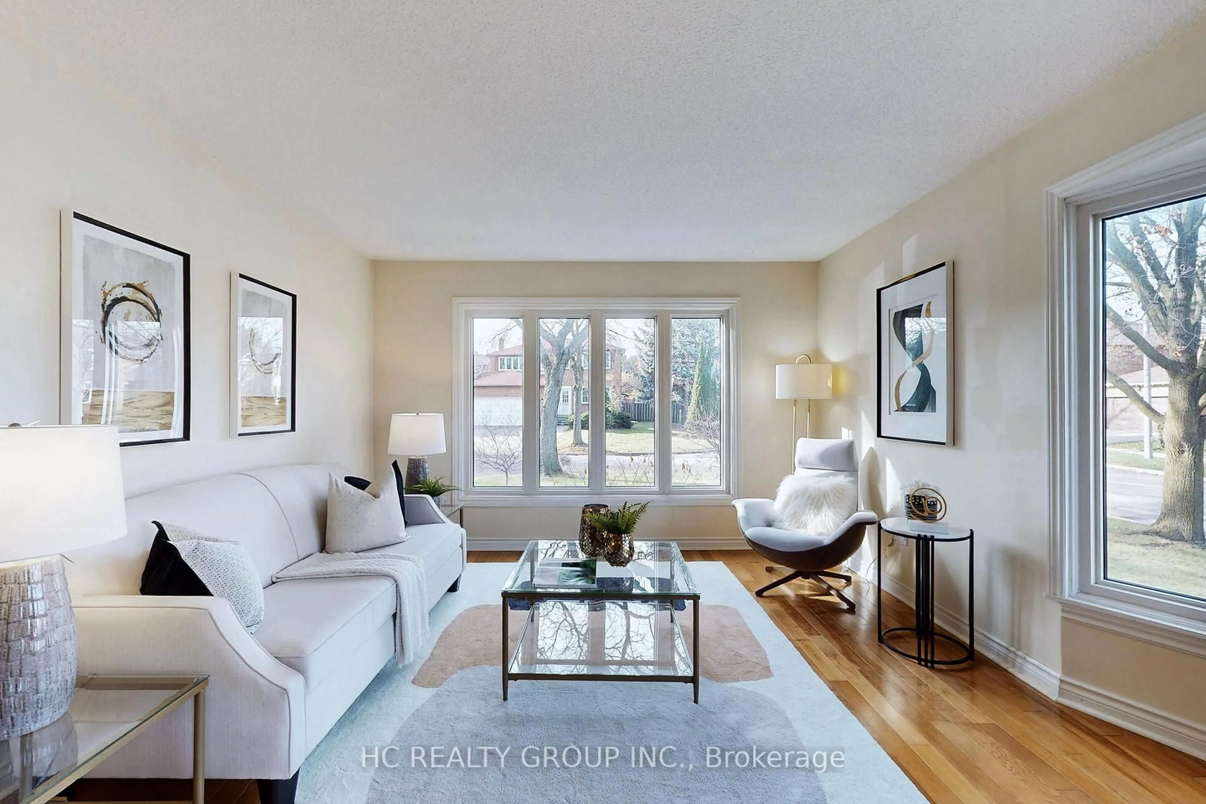 Living room with furniture, wood/laminate floor for 1 Atwood Crt, Markham Ontario L3T 6T4