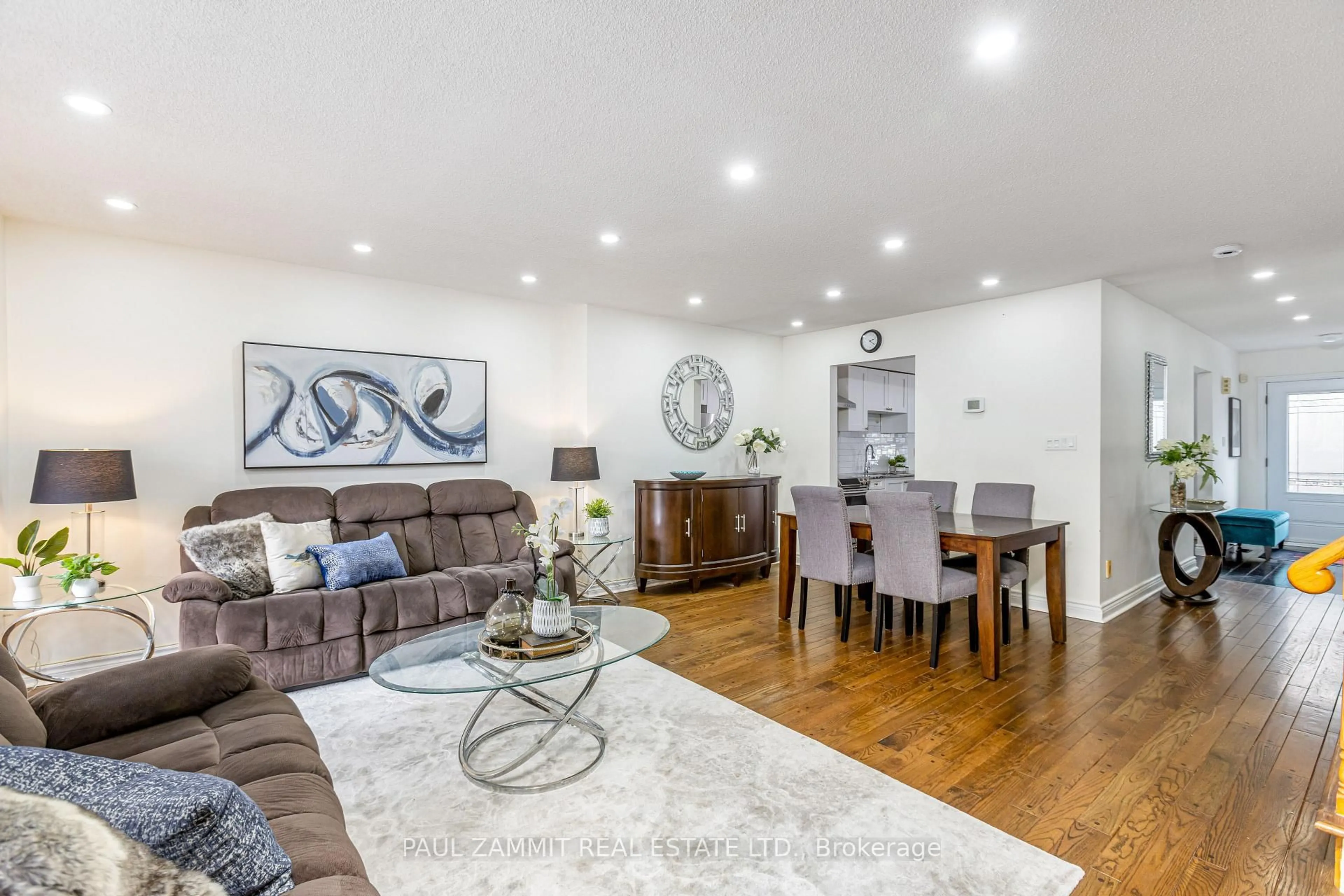 Living room with furniture, wood/laminate floor for 119 Confederation Way, Markham Ontario L3T 5R4