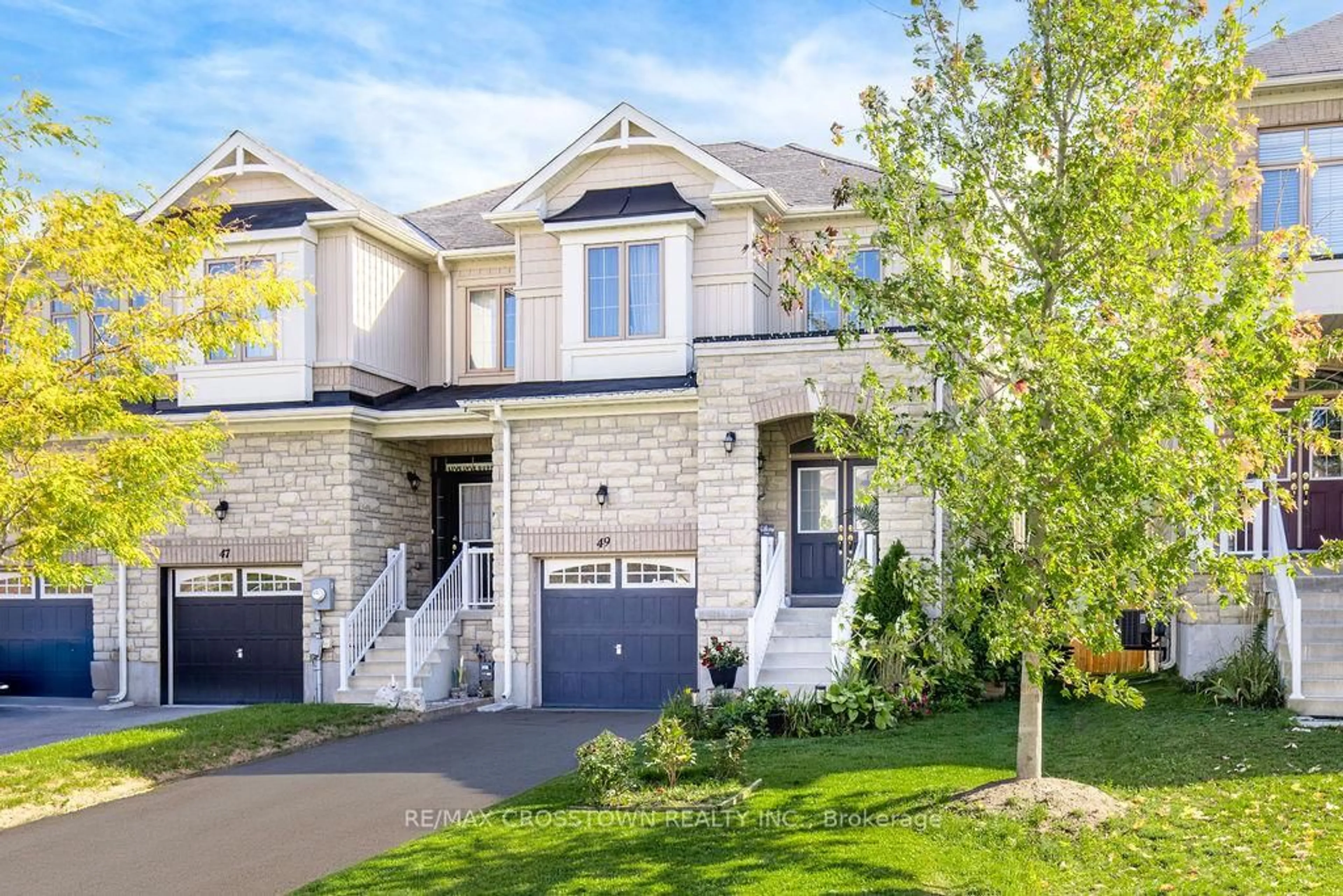 Home with brick exterior material, street for 49 Greenwood Dr, Essa Ontario L3W 0N5