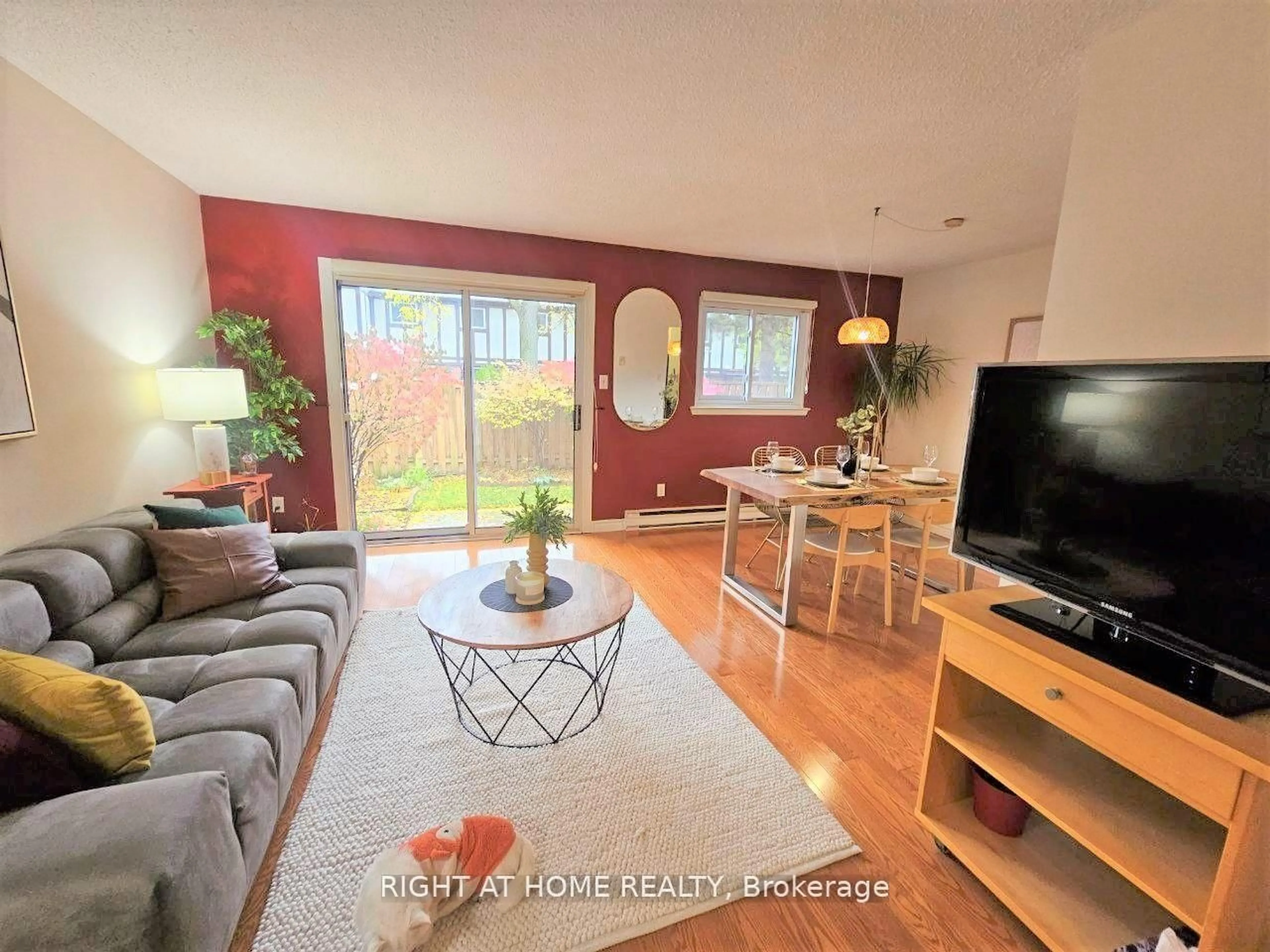 Living room with furniture, wood/laminate floor for 11 Reith Way #405, Markham Ontario L3T 5C6