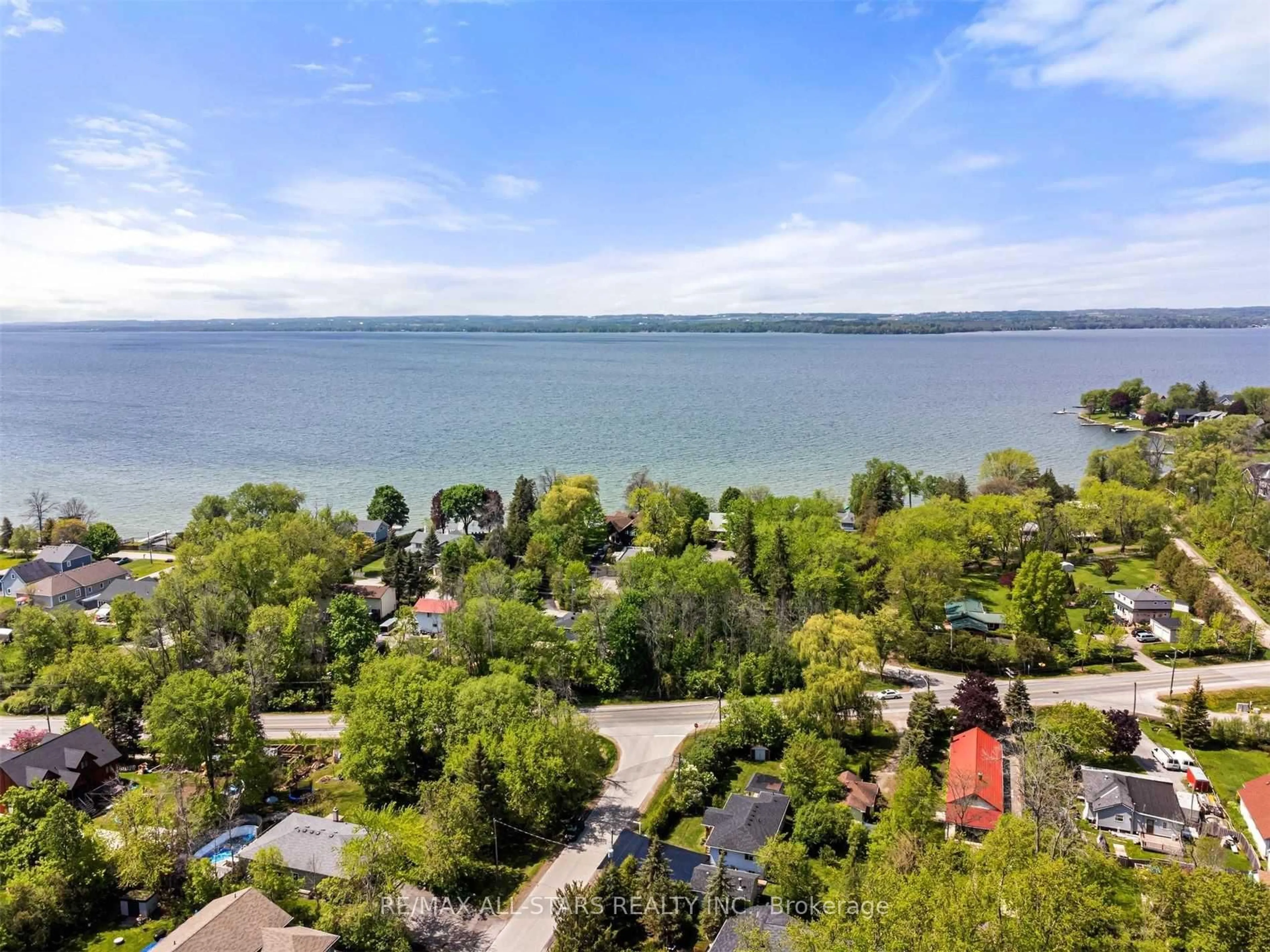 A pic from outside/outdoor area/front of a property/back of a property/a pic from drone, water/lake/river/ocean view for 4 Alice Ave, Georgina Ontario L3P 3C8