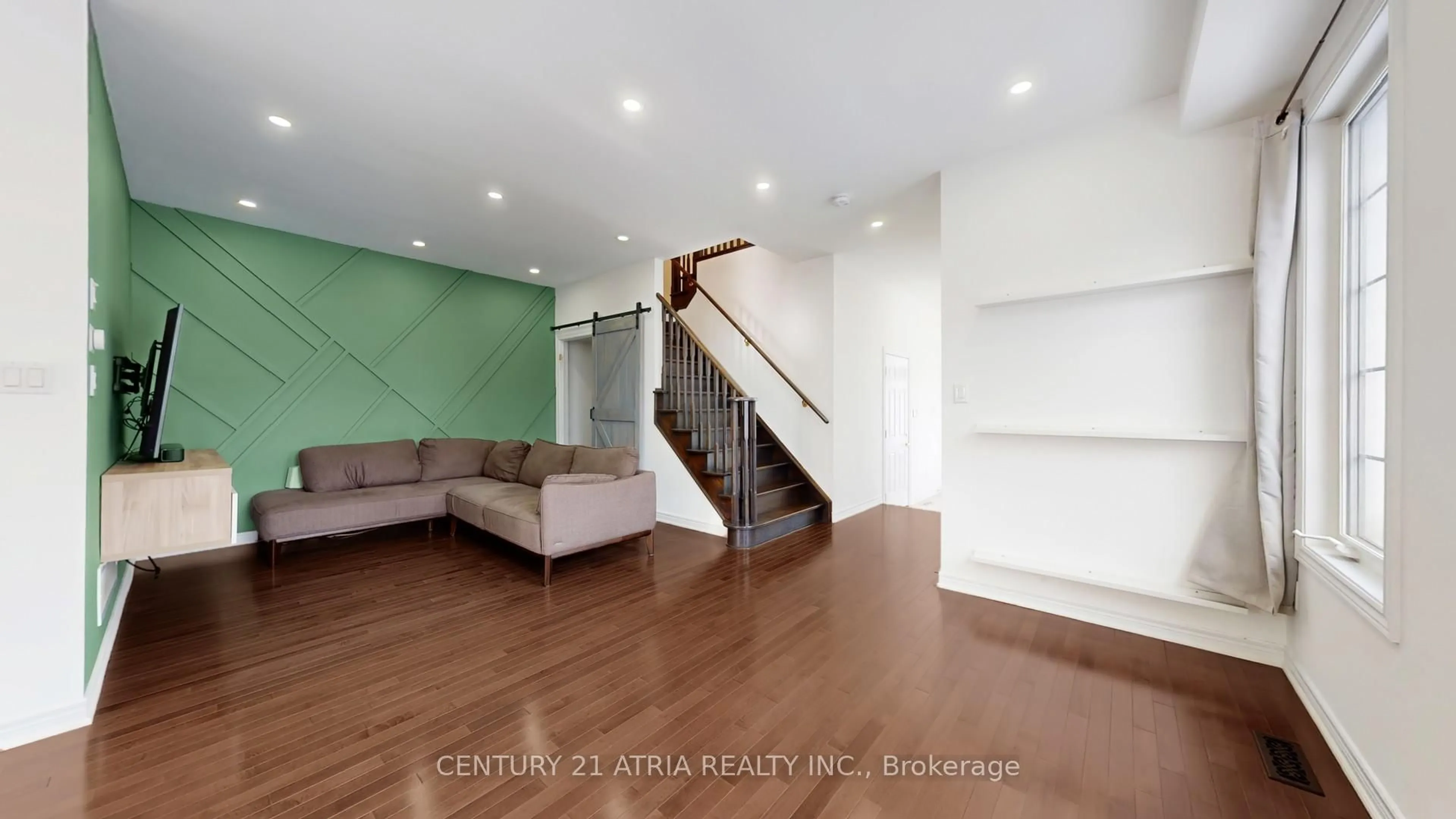 Living room with furniture, wood/laminate floor for 21 Gooseman Cres, Markham Ontario L6B 0S3