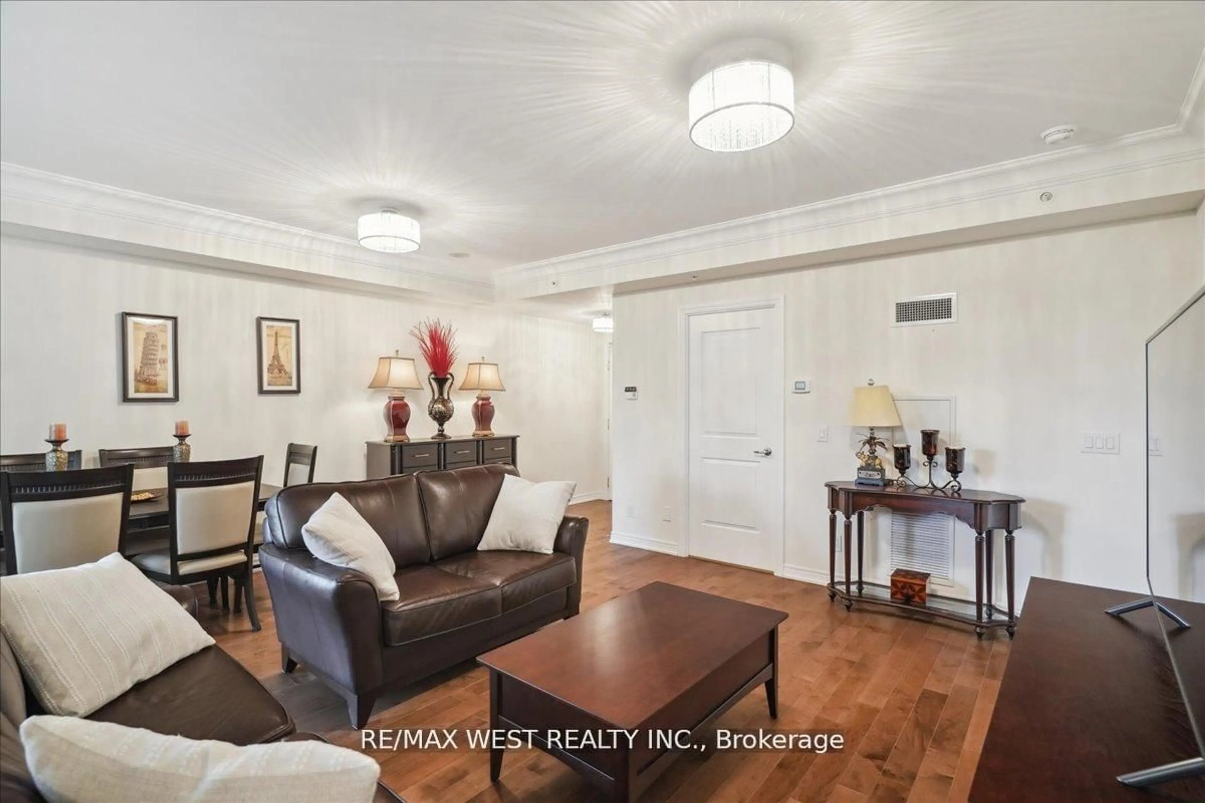 Living room with furniture, wood/laminate floor for 9255 Jane St #405, Vaughan Ontario L6A 0K1