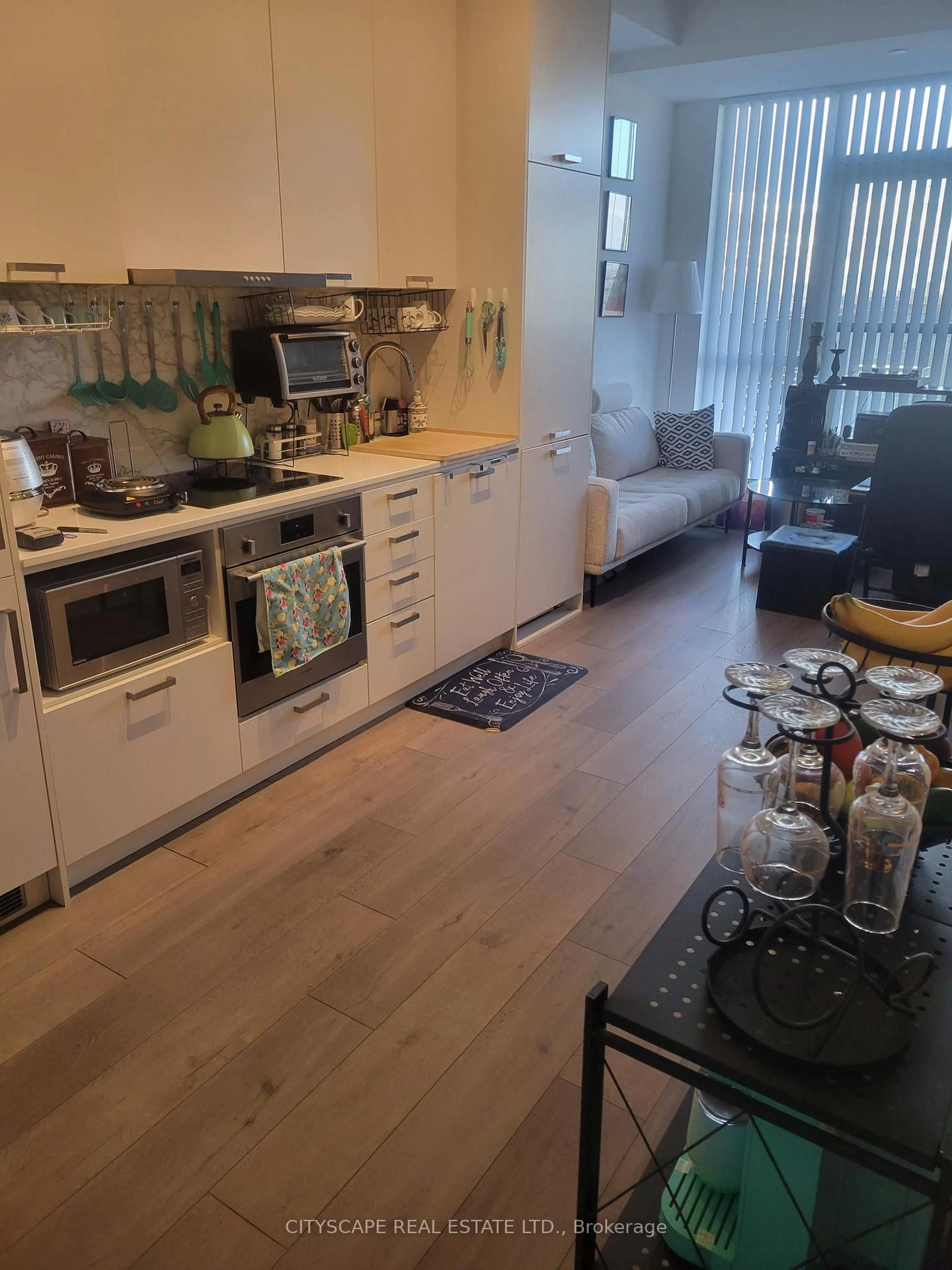 Open concept kitchen, wood/laminate floor for 38 Honeycrisp Cres #511, Vaughan Ontario L4K 0M8