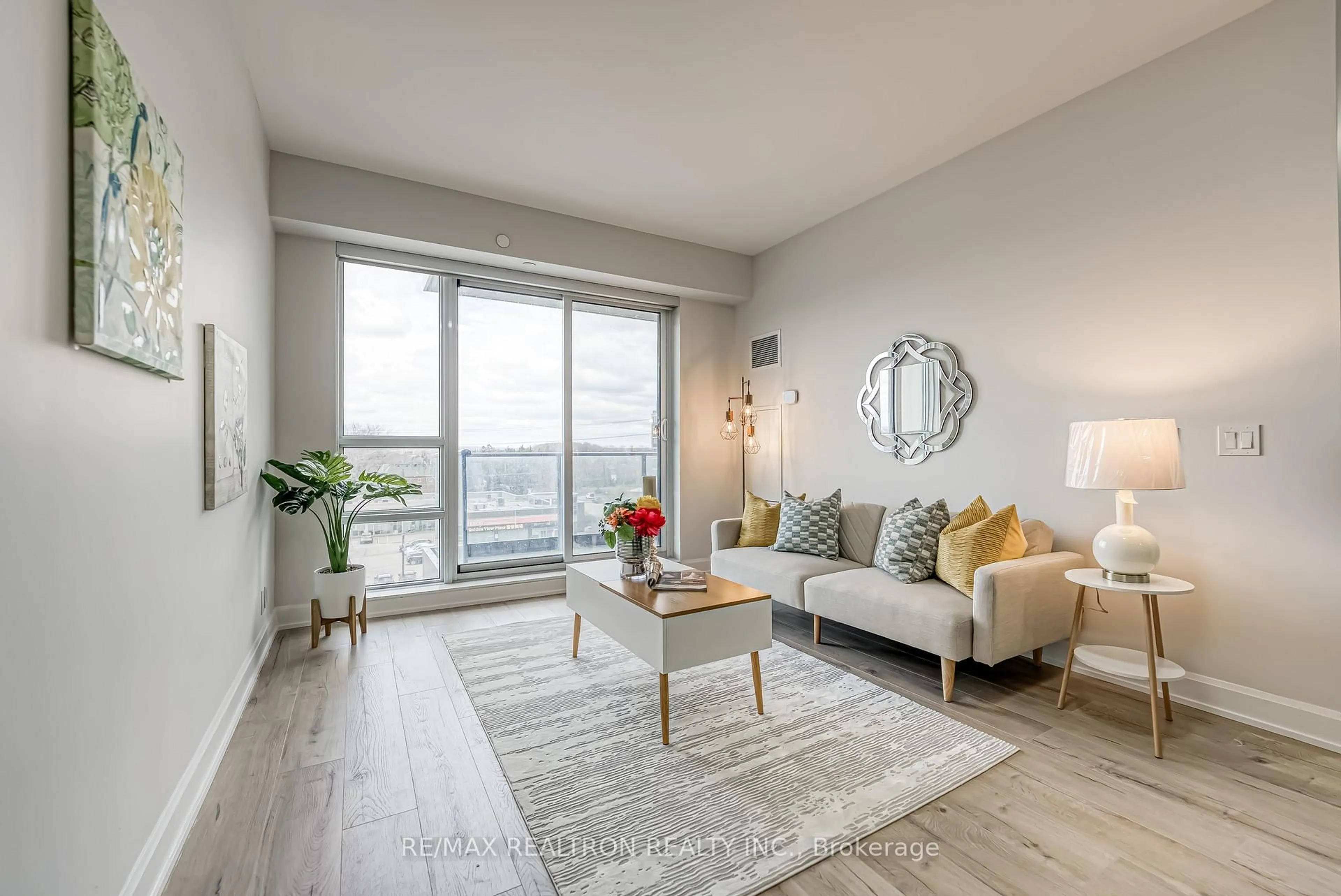 Living room with furniture, wood/laminate floor for 38 Gandhi Lane #602B, Markham Ontario L3T 0G9