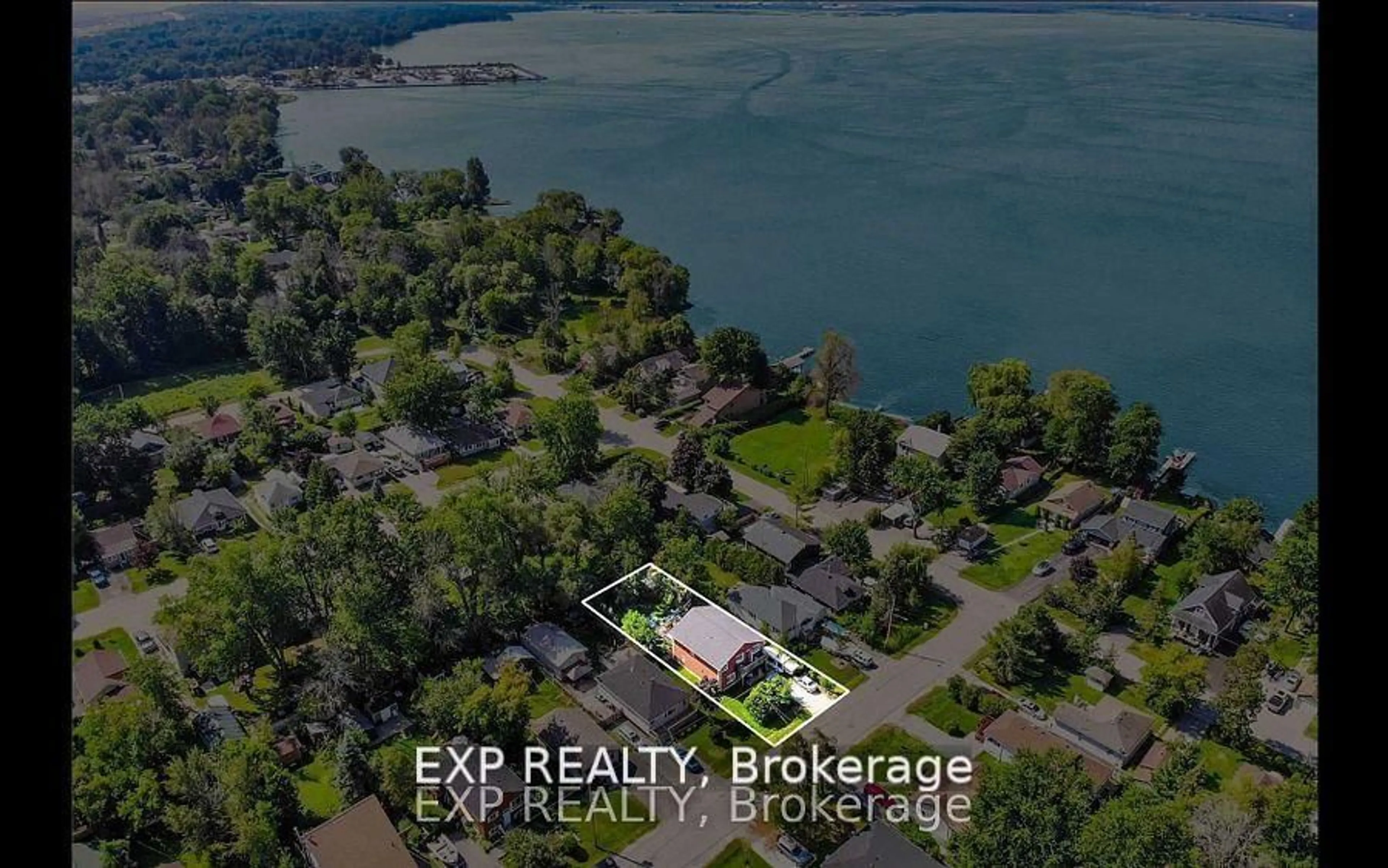 A pic from outside/outdoor area/front of a property/back of a property/a pic from drone, water/lake/river/ocean view for 201 Garden Ave, Georgina Ontario L4P 2L3