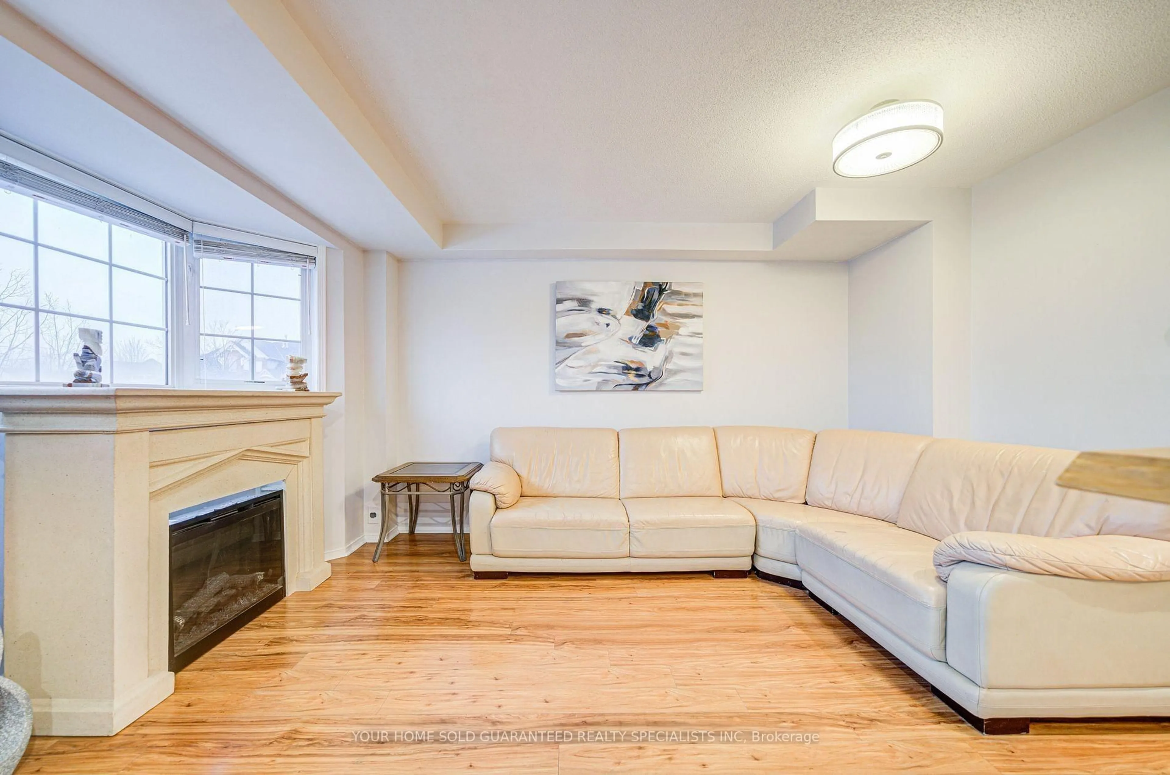 Living room with furniture, wood/laminate floor for 15 Cornell Meadows Ave #A206, Markham Ontario L6B 1B6