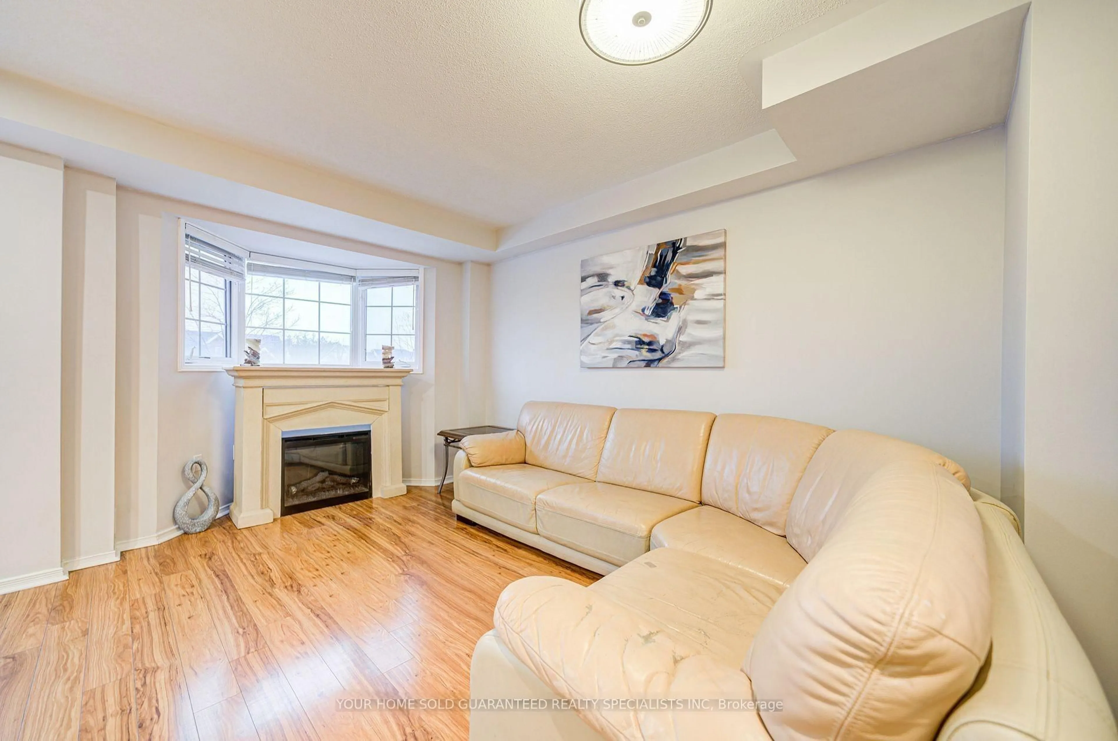 Living room with furniture, wood/laminate floor for 15 Cornell Meadows Ave #A206, Markham Ontario L6B 1B6