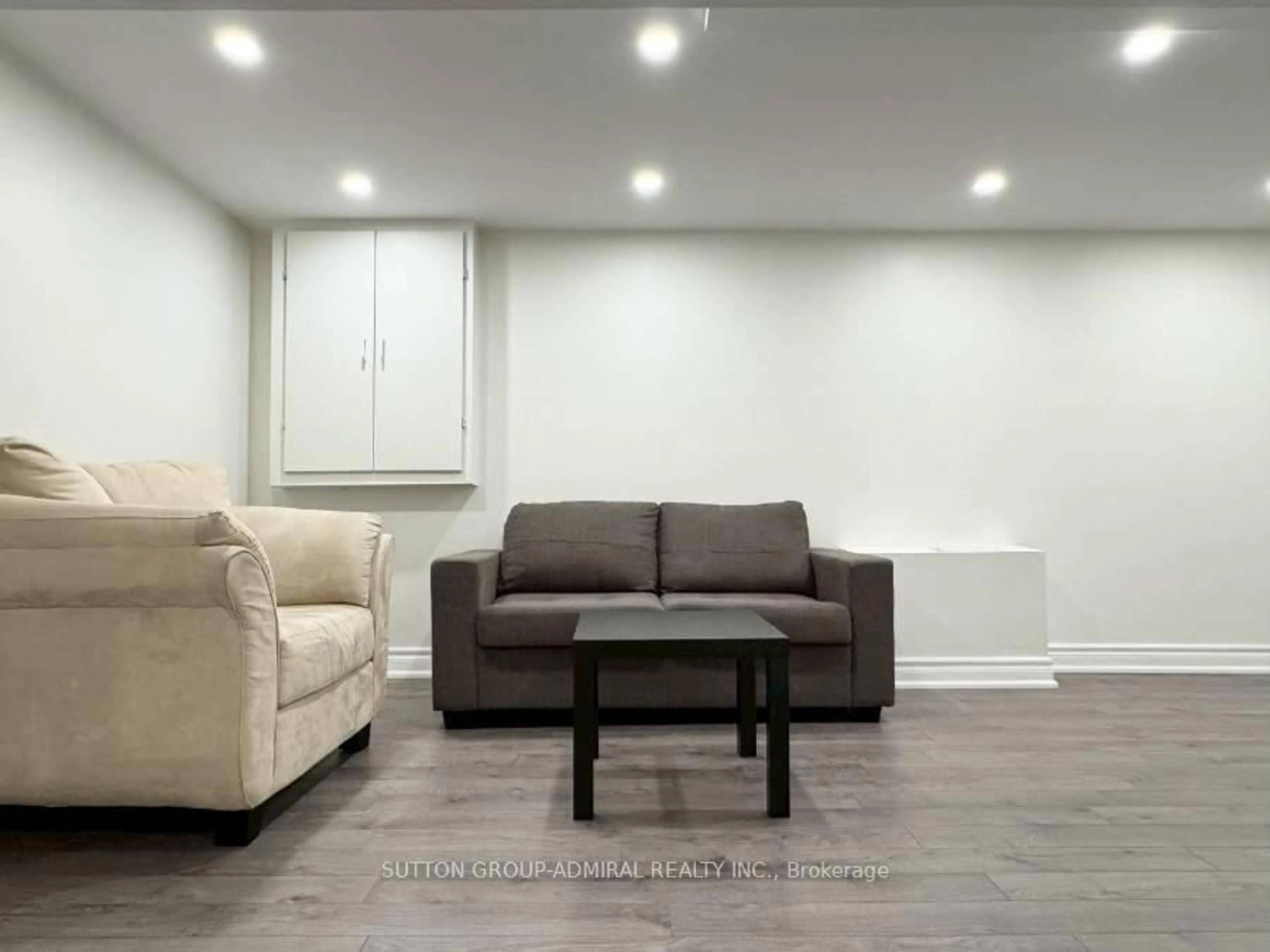 Living room with furniture, wood/laminate floor for 7 Judith Ave #Basement, Vaughan Ontario L4J 7J3