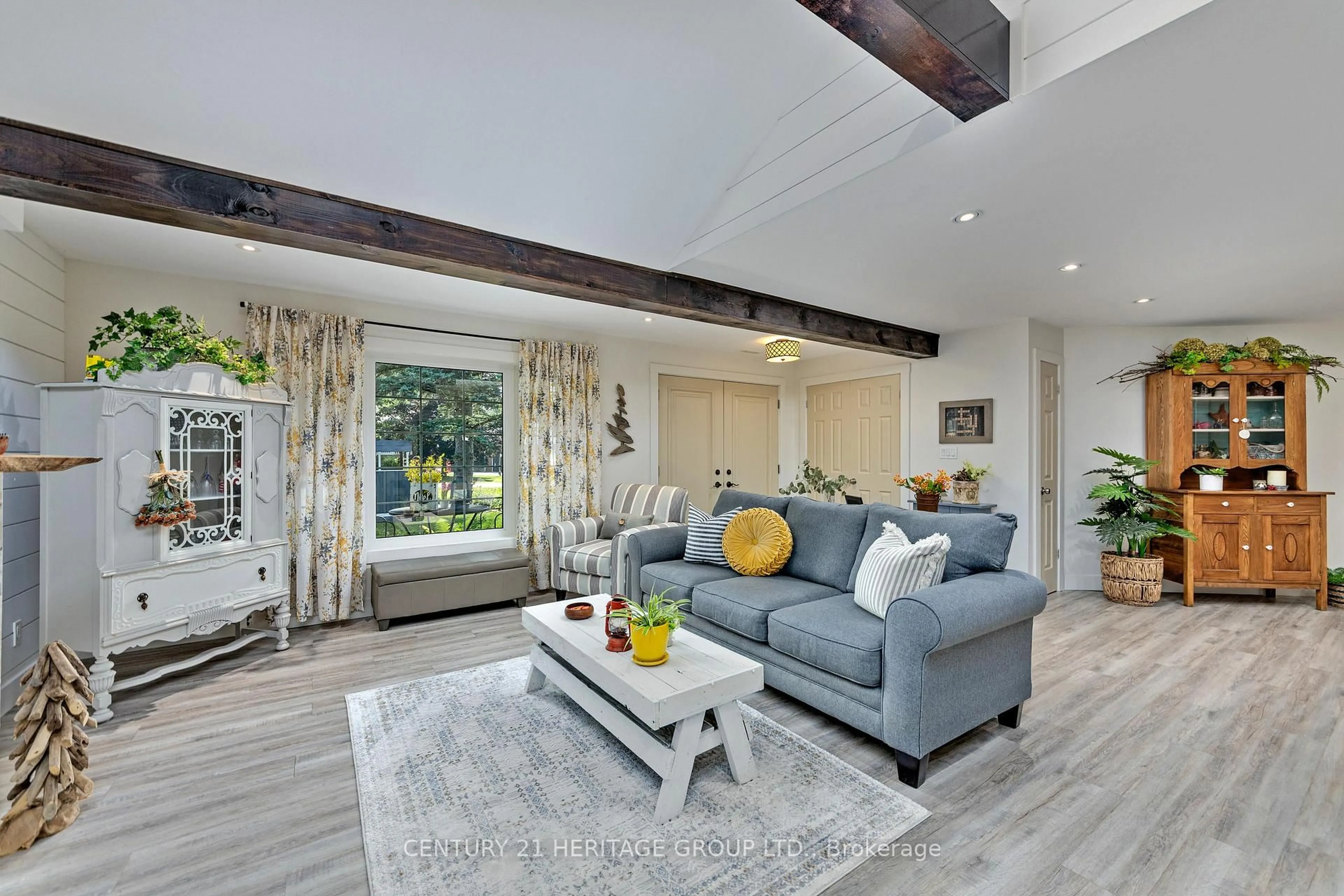 Living room with furniture, wood/laminate floor for 182 Parkview Dr, Innisfil Ontario L0L 1R0