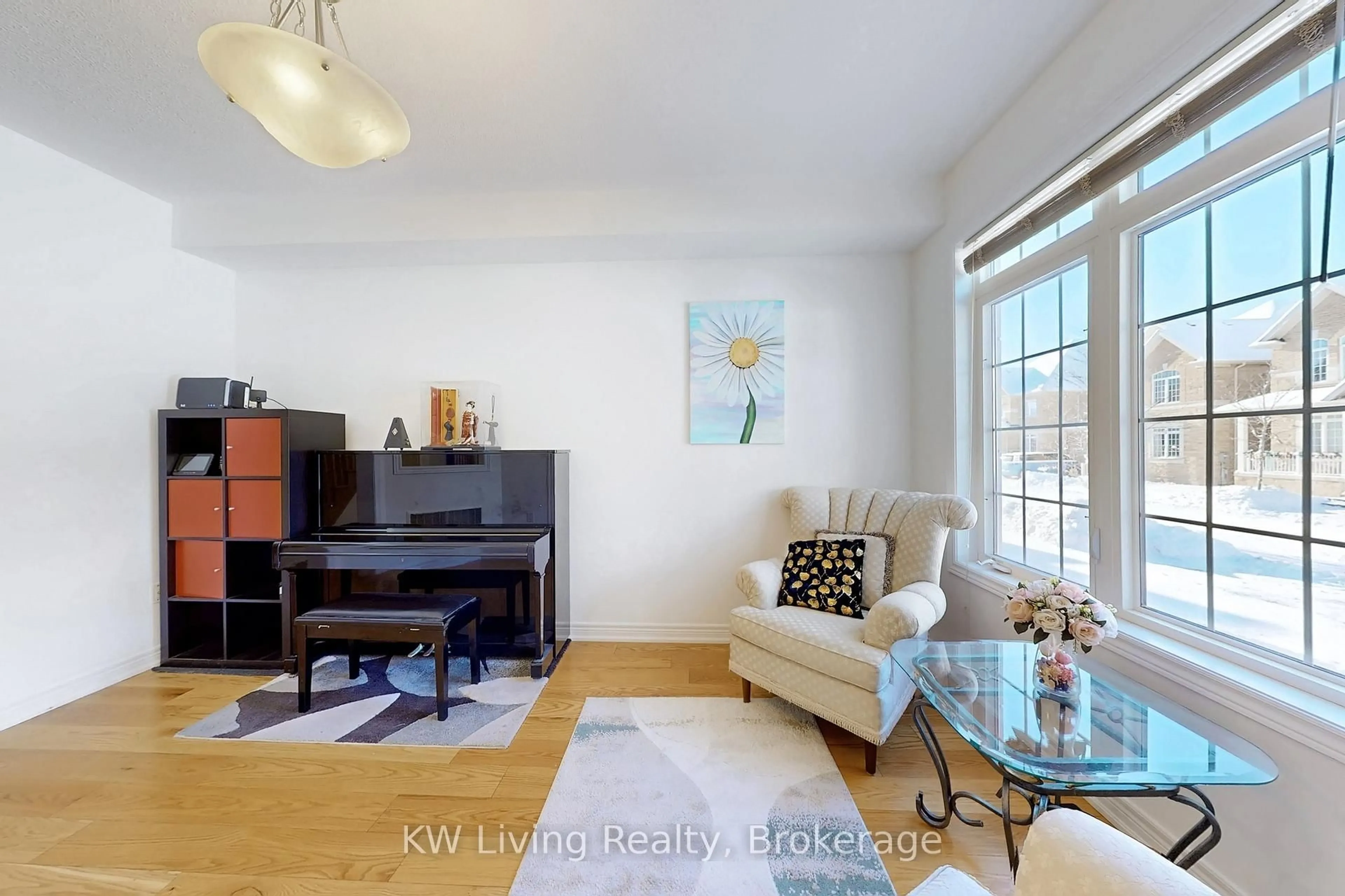 Living room with furniture, wood/laminate floor for 19 Begonia St, Markham Ontario L6E 0N3