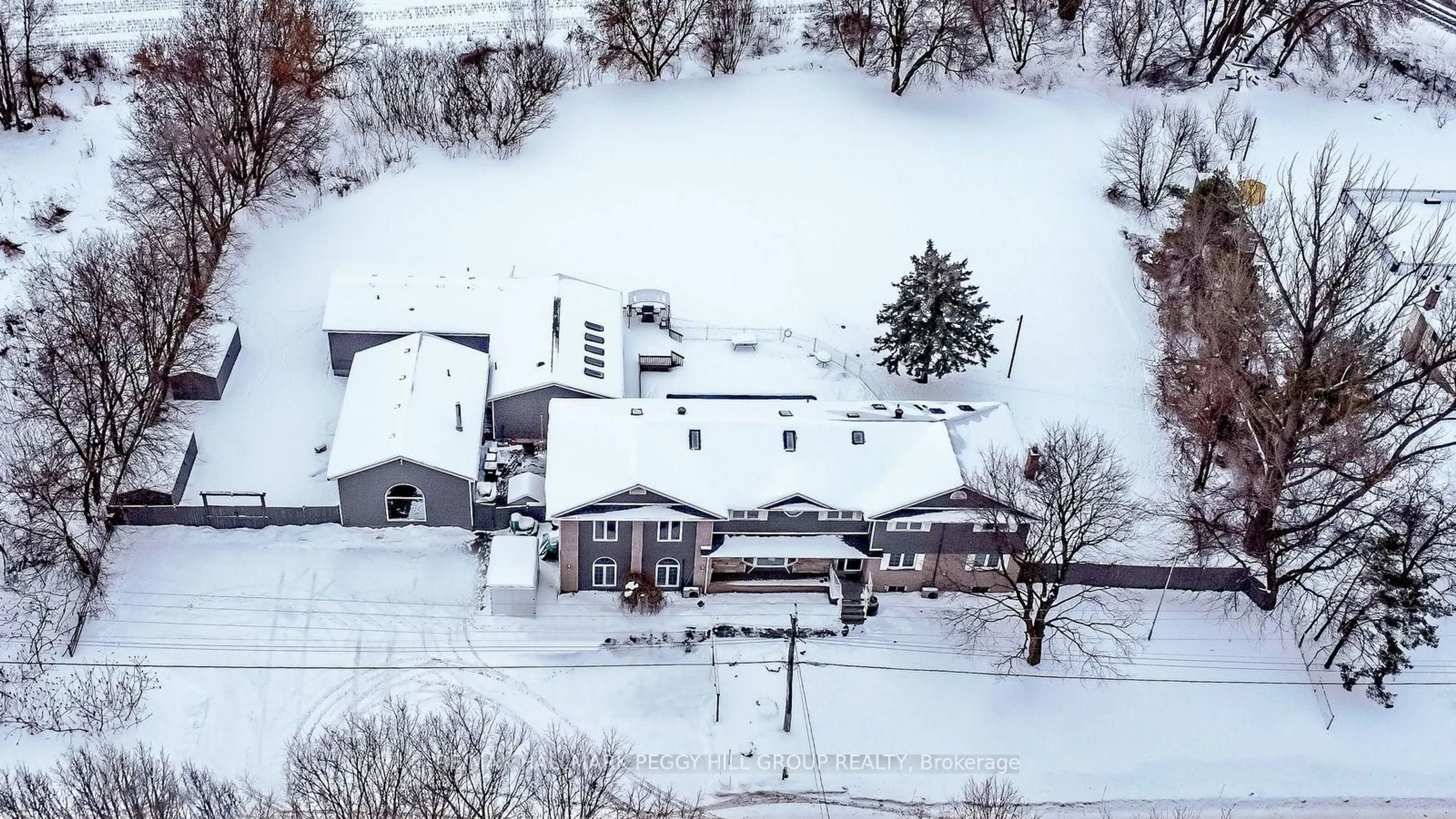A pic from outside/outdoor area/front of a property/back of a property/a pic from drone, street for 1923 10th Line, Innisfil Ontario L9S 3P5