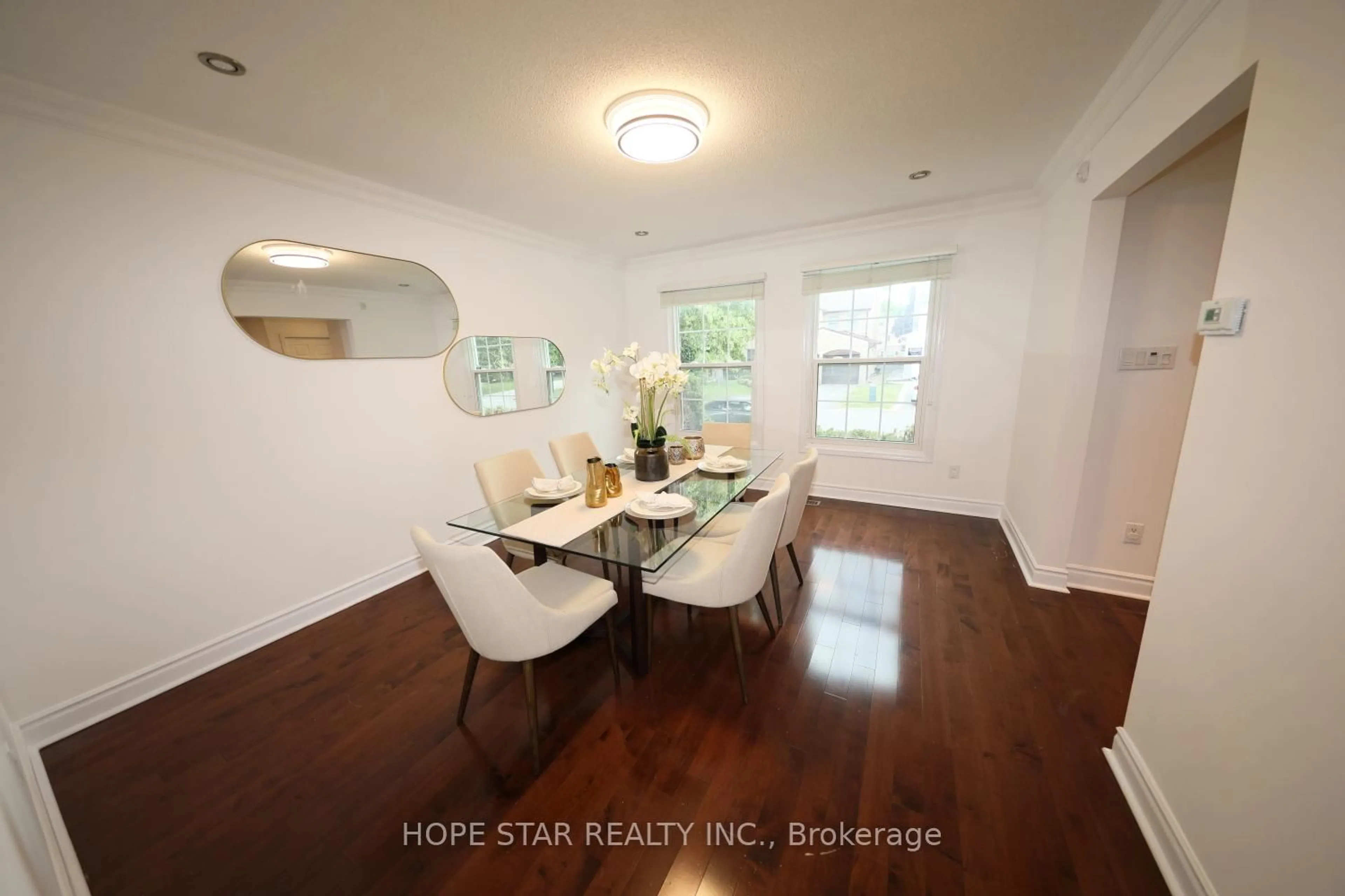 Dining room, wood/laminate floor for 26 Ferndell Circ, Markham Ontario L3R 3Y8