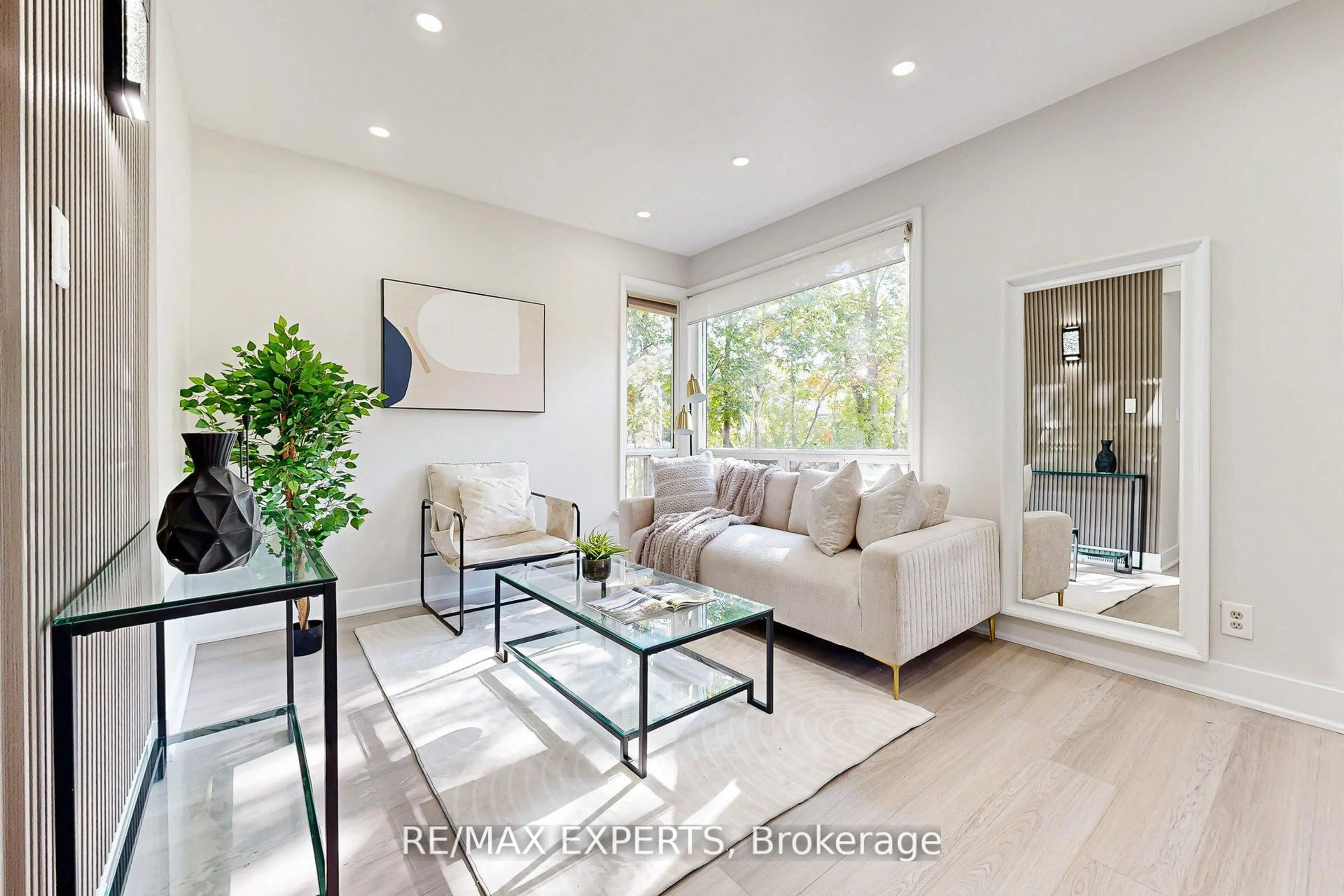 Living room with furniture, wood/laminate floor for 261 Helmer Ave, Newmarket Ontario L3Y 4L8