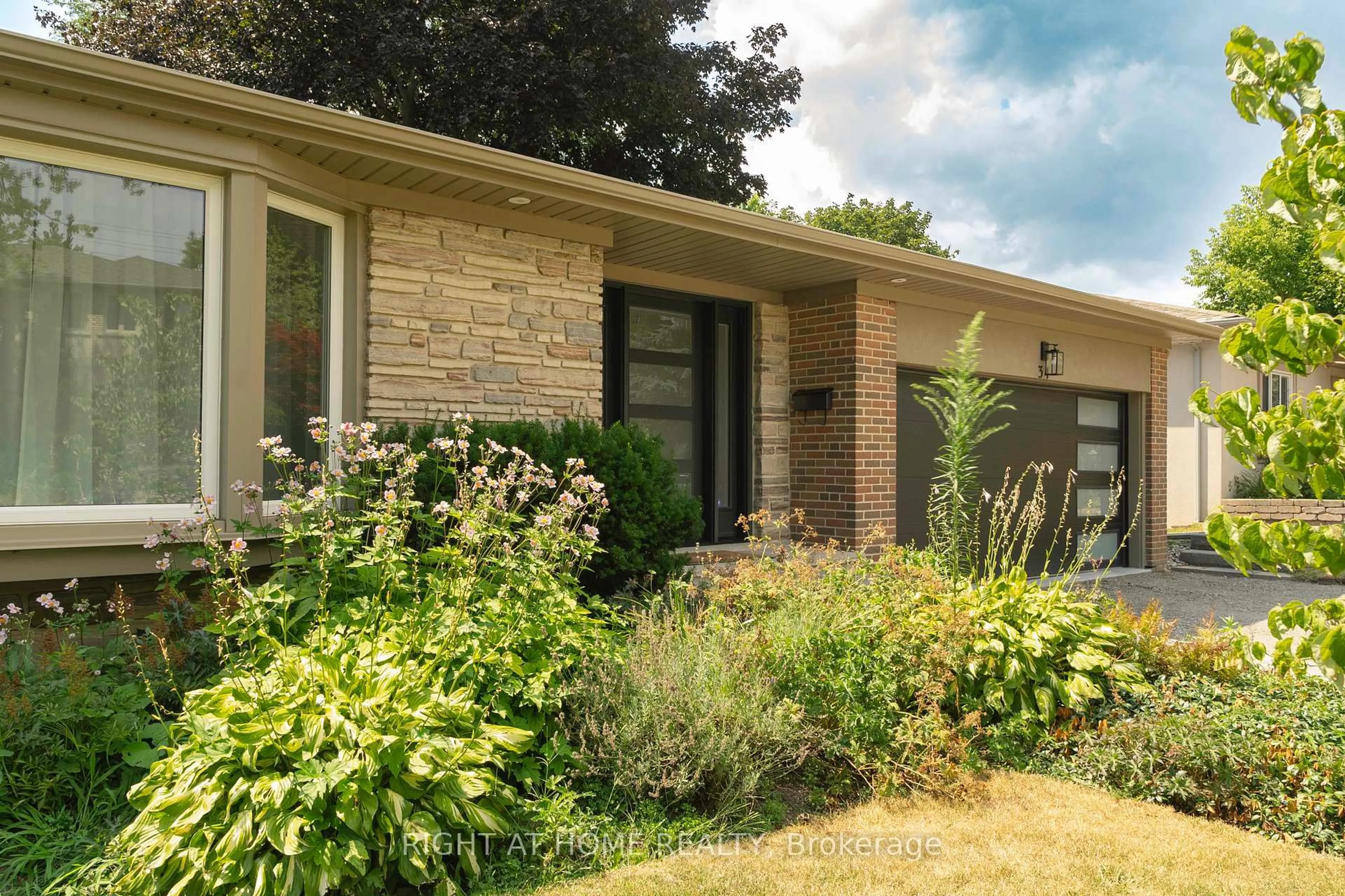 Home with brick exterior material, street for 34 Wildrose Cres, Markham Ontario L3T 1N5