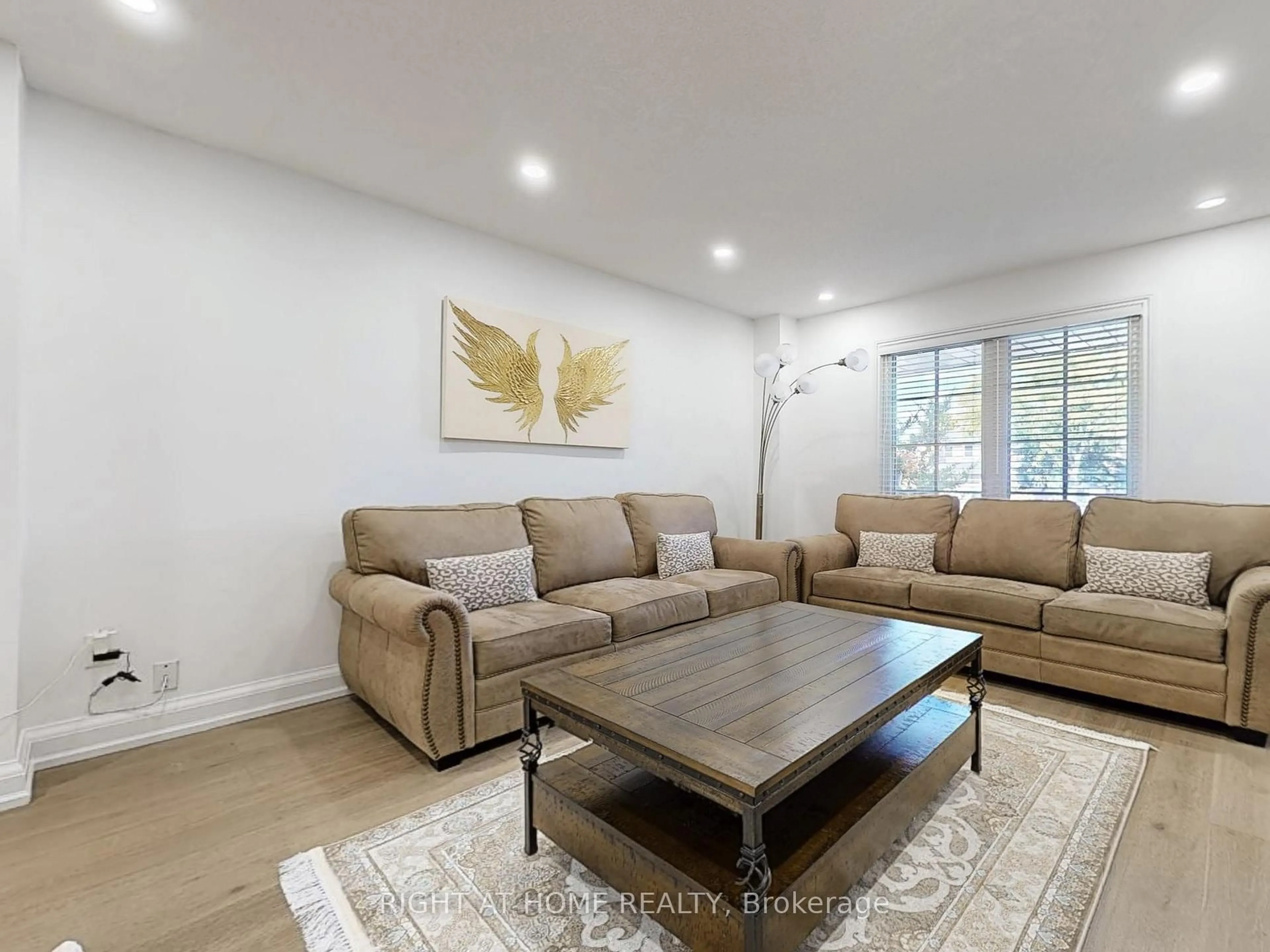 Living room with furniture, wood/laminate floor for 828 Leslie Valley Dr, Newmarket Ontario L3Y 7H3