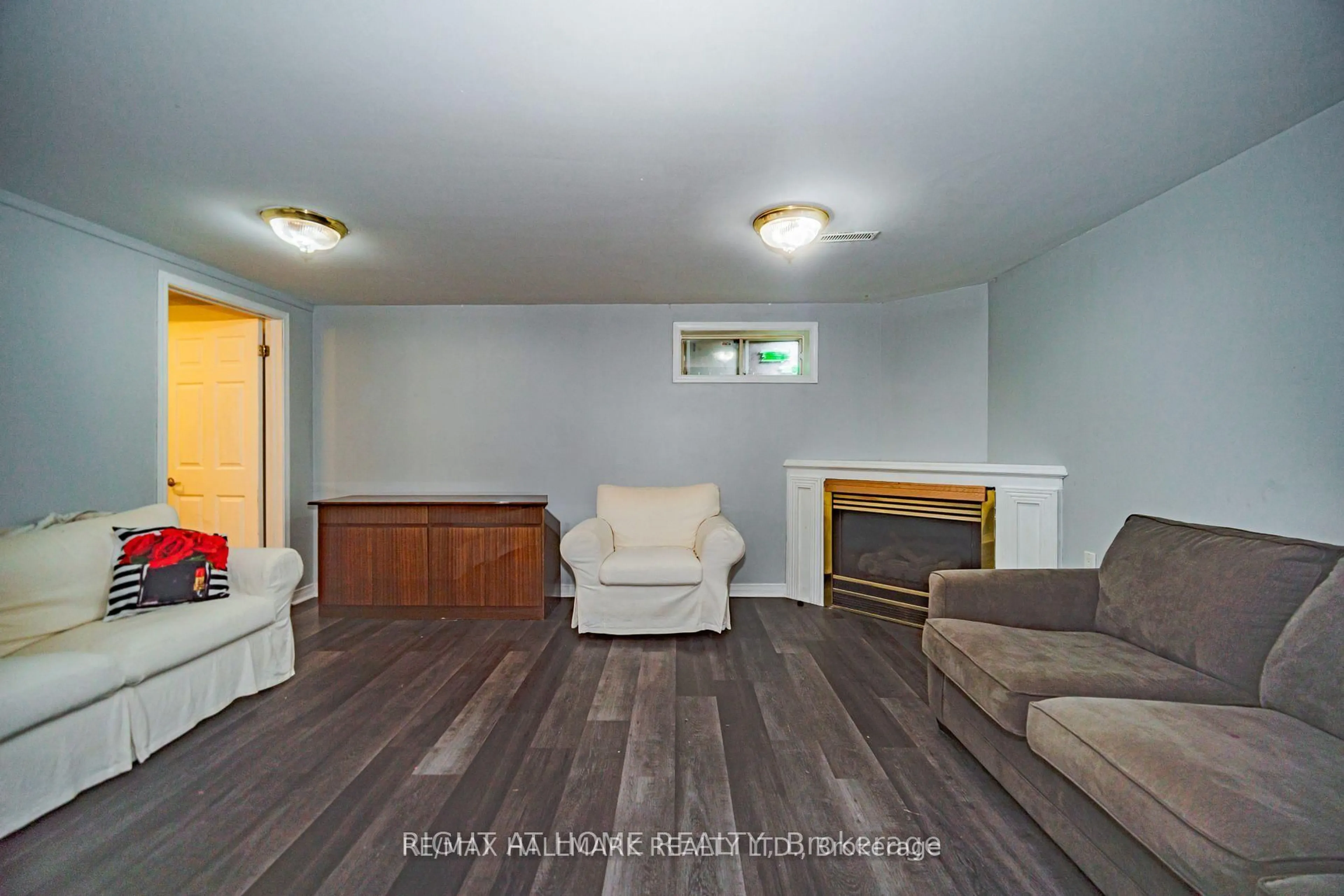 Living room with furniture, wood/laminate floor for 4 Devins Dr, Aurora Ontario L4G 2Z1