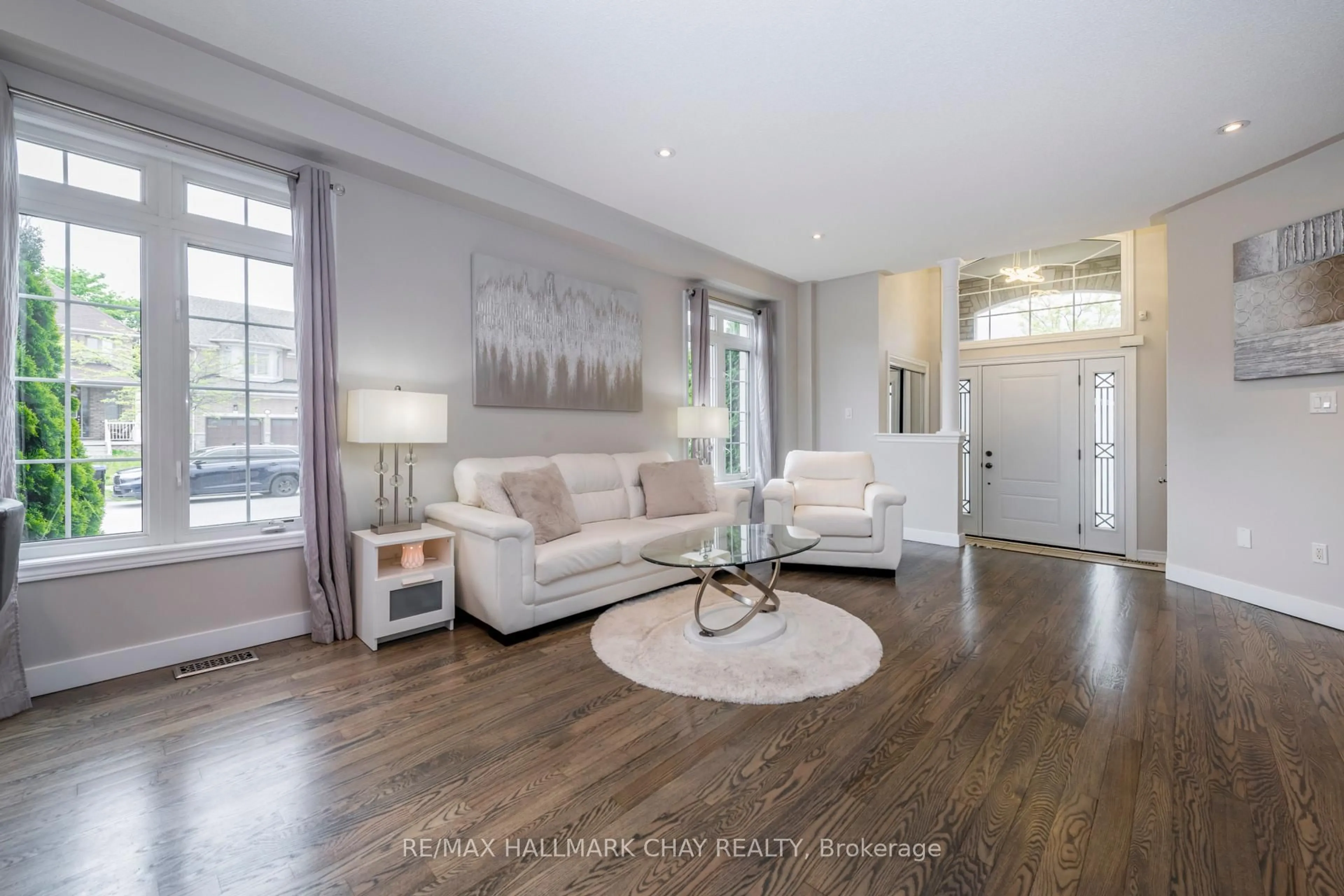 Living room with furniture, wood/laminate floor for 1300 Hunter St, Innisfil Ontario L9S 0H1