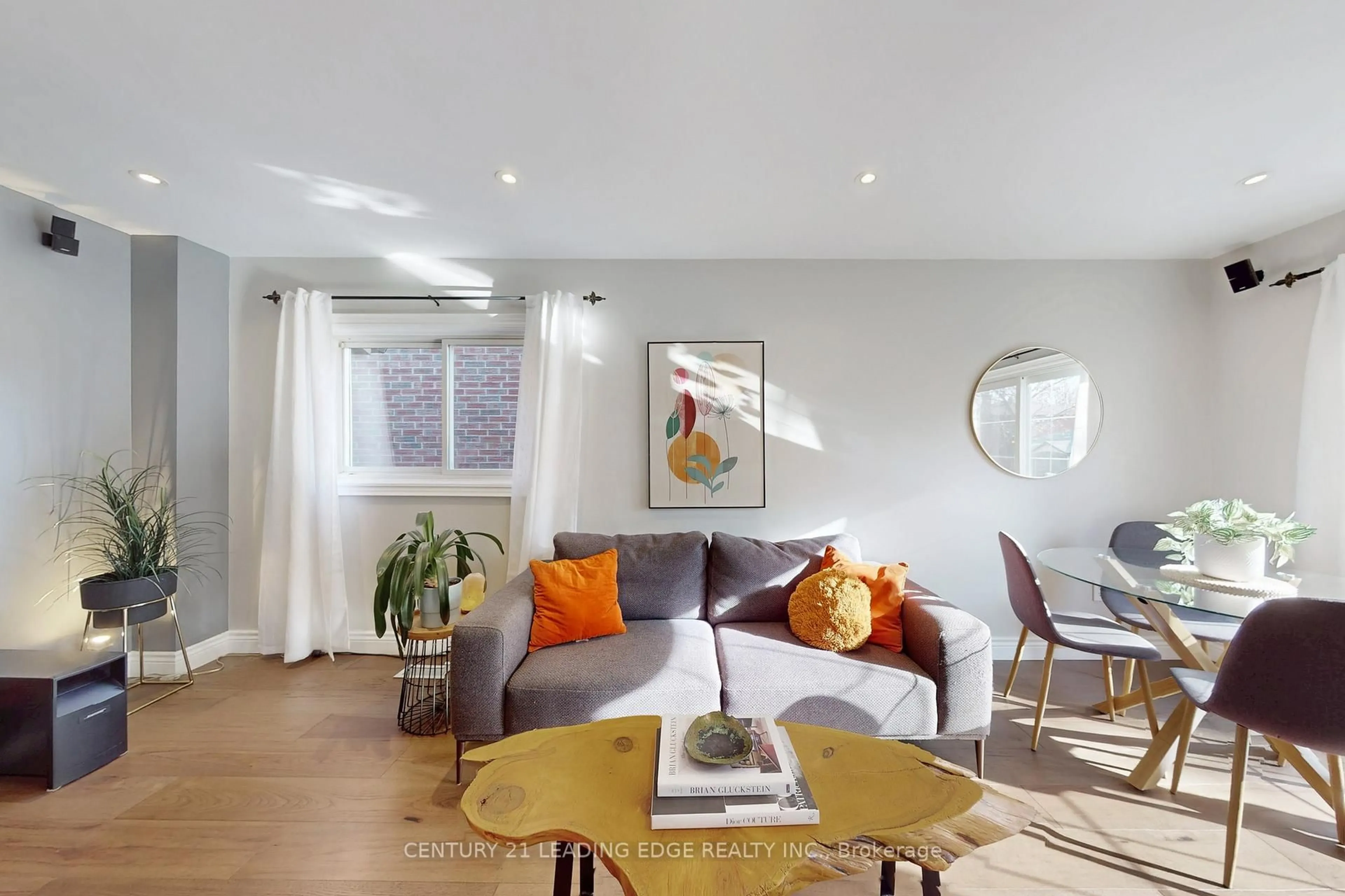 Living room with furniture, wood/laminate floor for 49 Madsen Cres, Markham Ontario L3R 4P2