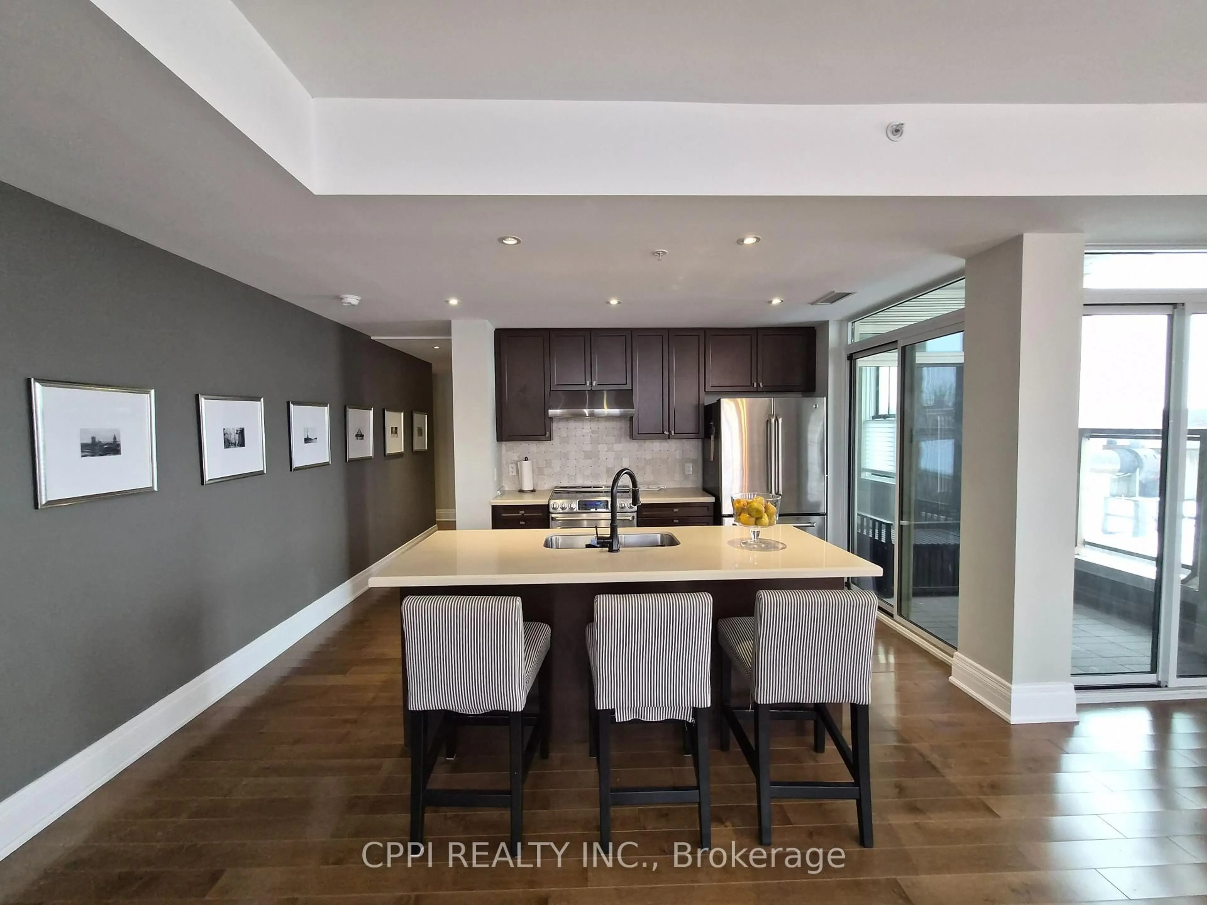 Open concept kitchen, wood/laminate floor for 68 Main St #329, Markham Ontario L3P 0N5