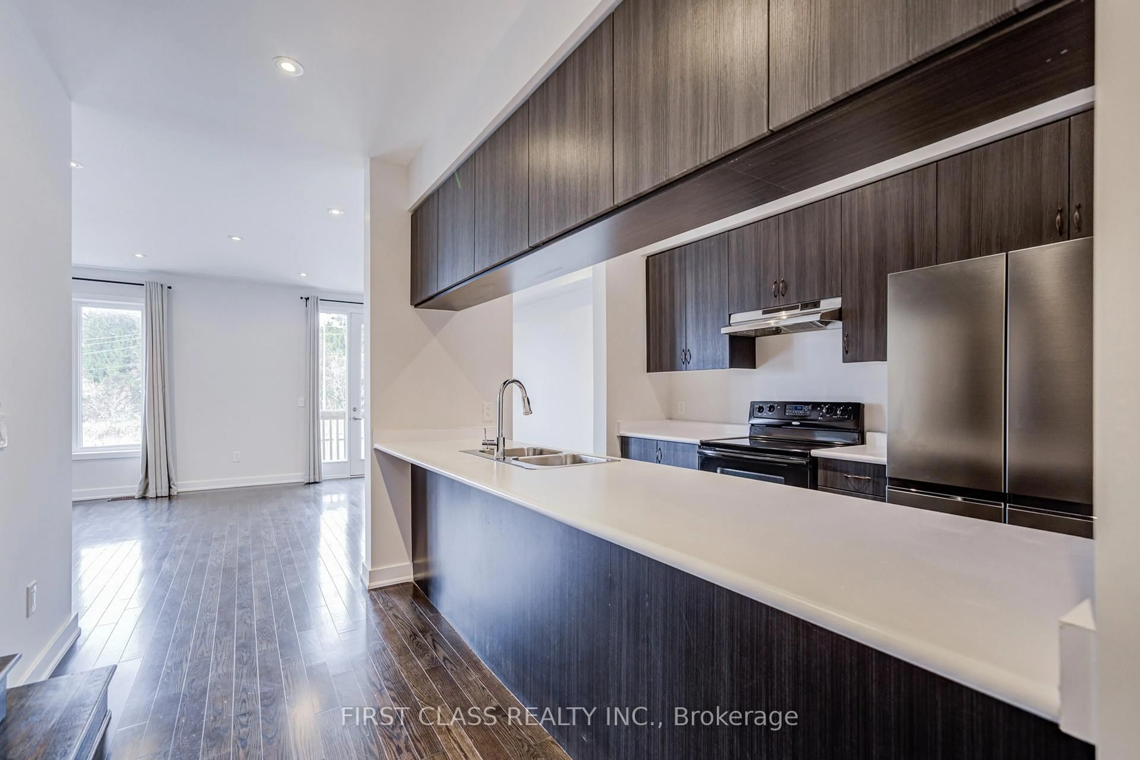 Open concept kitchen, wood/laminate floor for 52 Helliwell Cres, Richmond Hill Ontario L4E 1C7