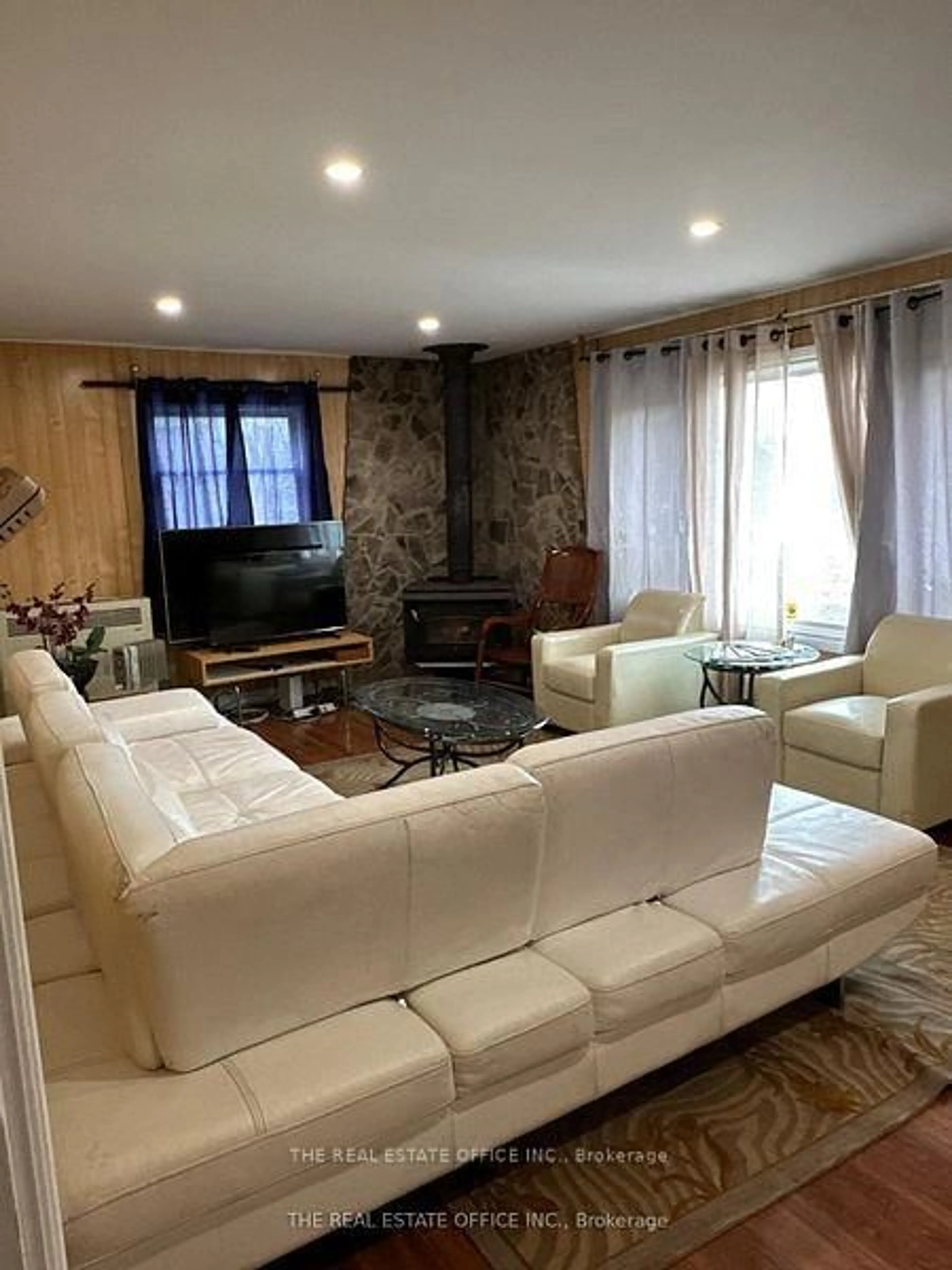 Living room with furniture, wood/laminate floor for 393 Adeline Dr, Georgina Ontario L4P 3C4