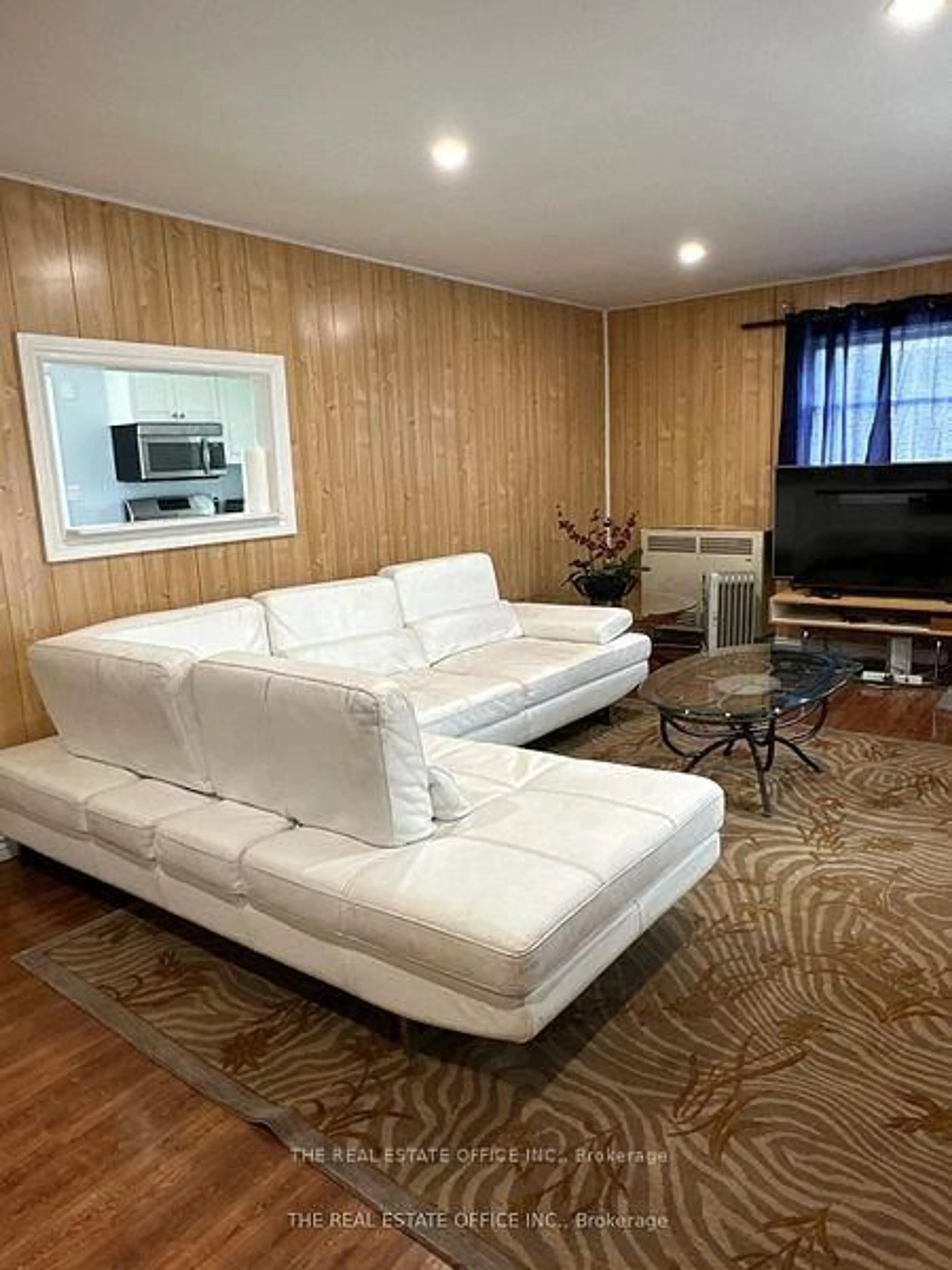 Living room with furniture, wood/laminate floor for 393 Adeline Dr, Georgina Ontario L4P 3C4
