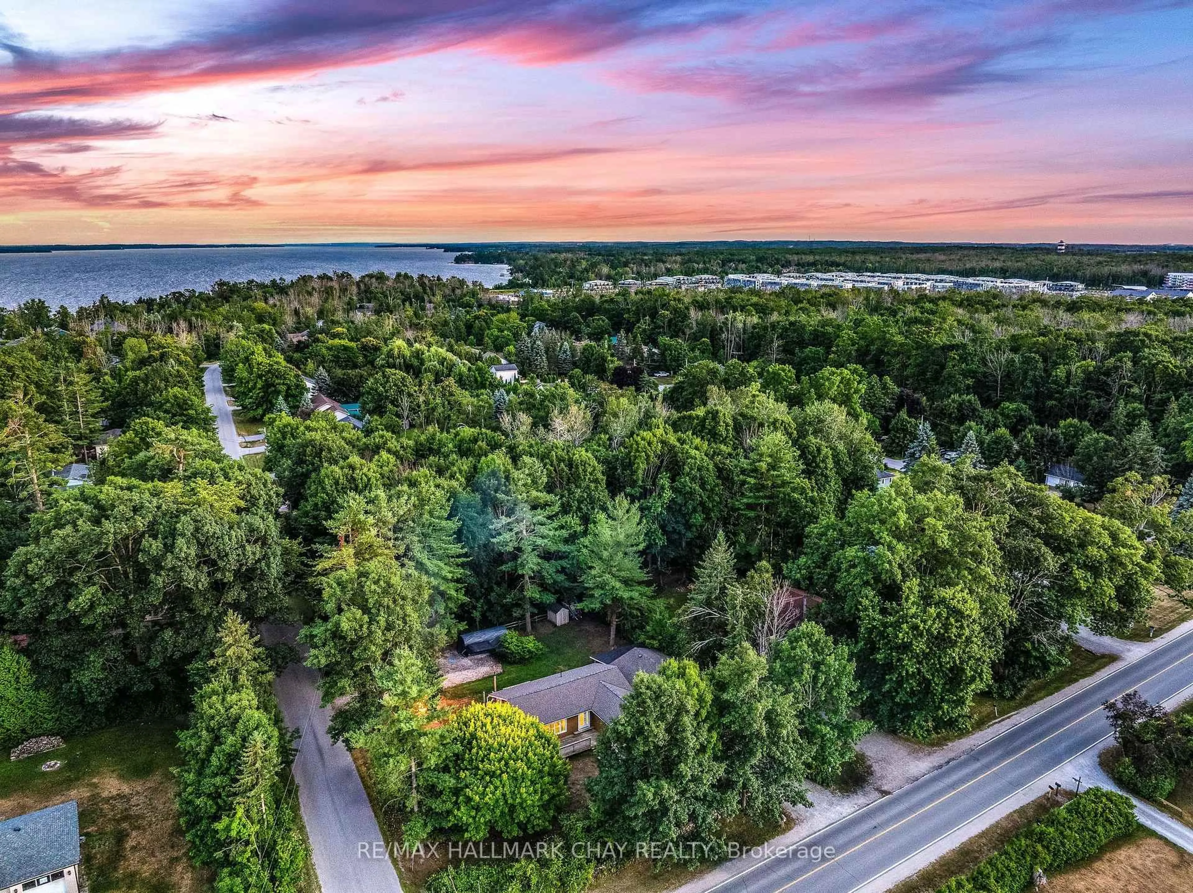 A pic from outside/outdoor area/front of a property/back of a property/a pic from drone, water/lake/river/ocean view for 135 Big Bay Point Rd, Innisfil Ontario L9S 2N3