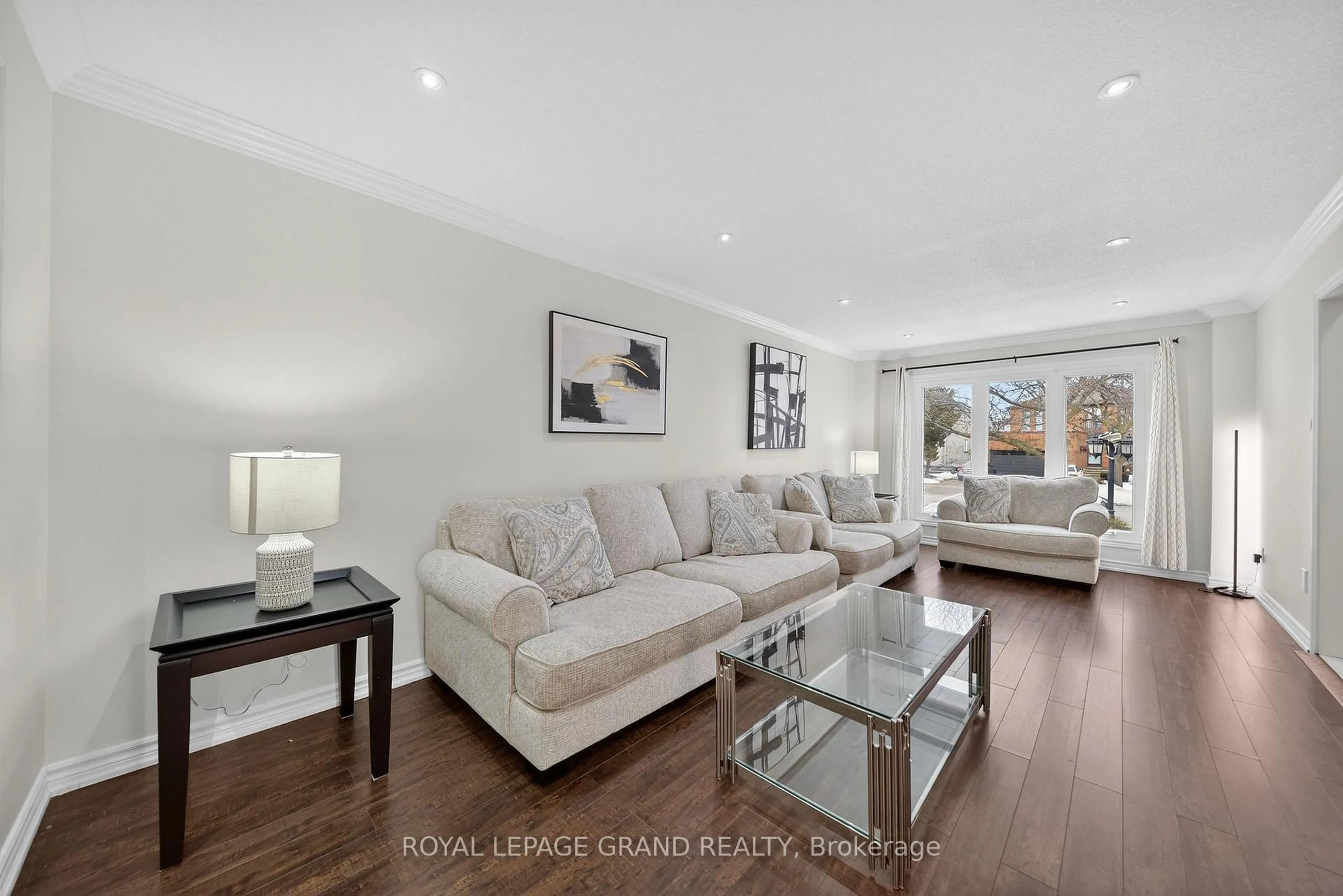 Living room with furniture, wood/laminate floor for 17 Coleraine Ave, Markham Ontario L3S 2L9