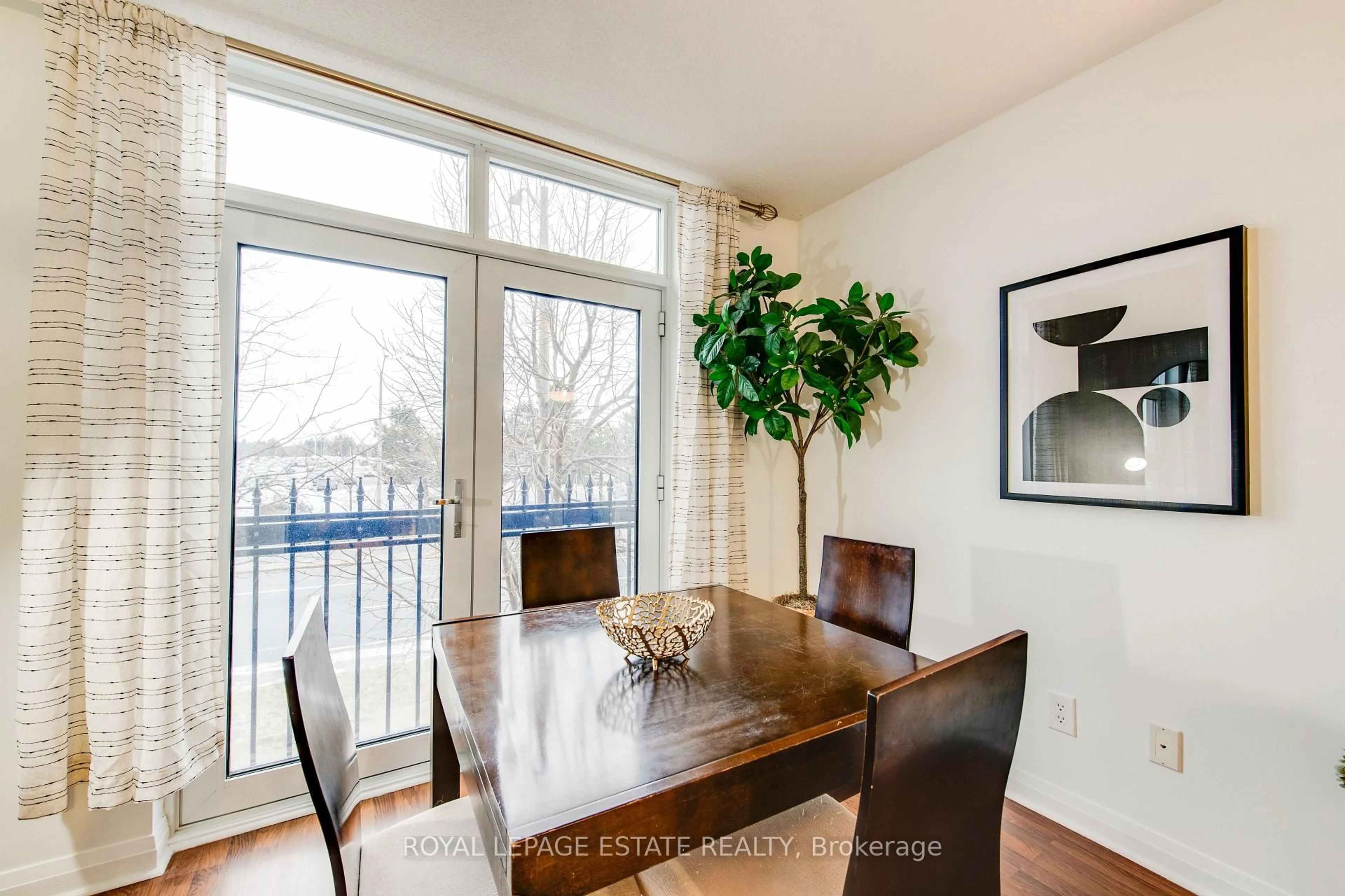 Dining room, wood/laminate floor for 7363 Kennedy Rd #213, Markham Ontario L3R 1G8