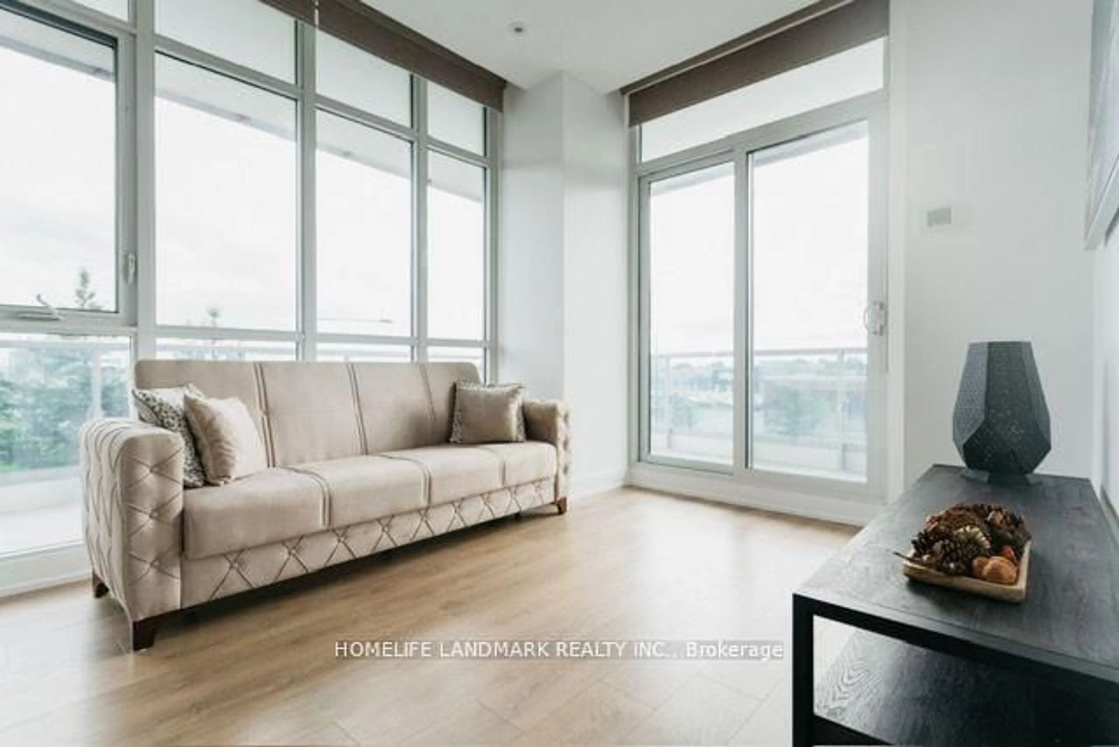 Living room with furniture, wood/laminate floor for 9471 Yonge St #234, Richmond Hill Ontario L4C 0Z5