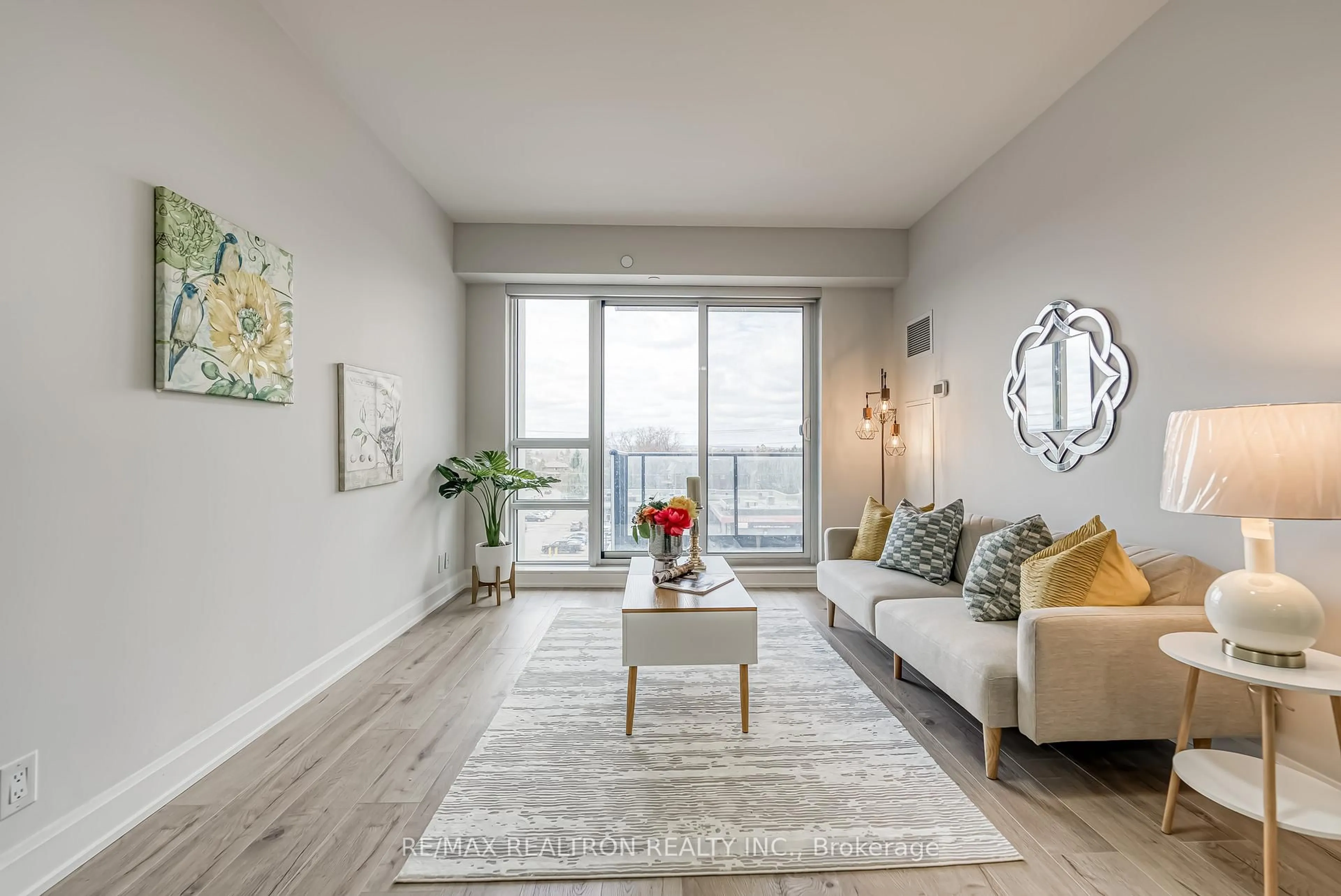 Living room with furniture, wood/laminate floor for 38 Gandhi Lane #602B, Markham Ontario L3T 0G9