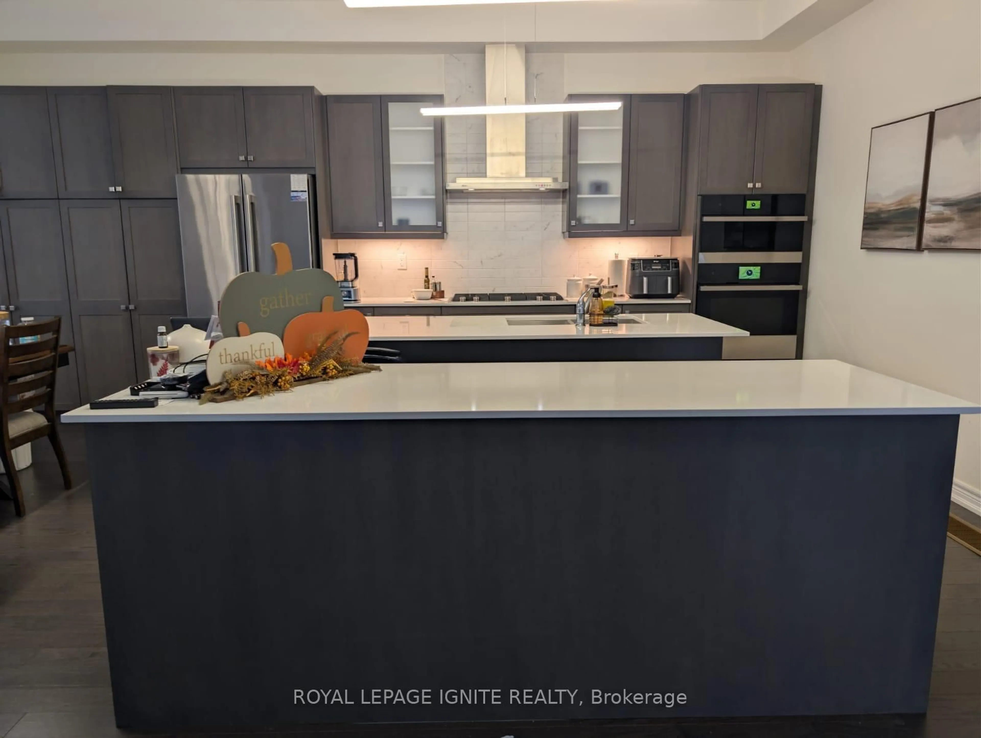Open concept kitchen, wood/laminate floor for 31 Canard Dr, Vaughan Ontario L4H 5C4