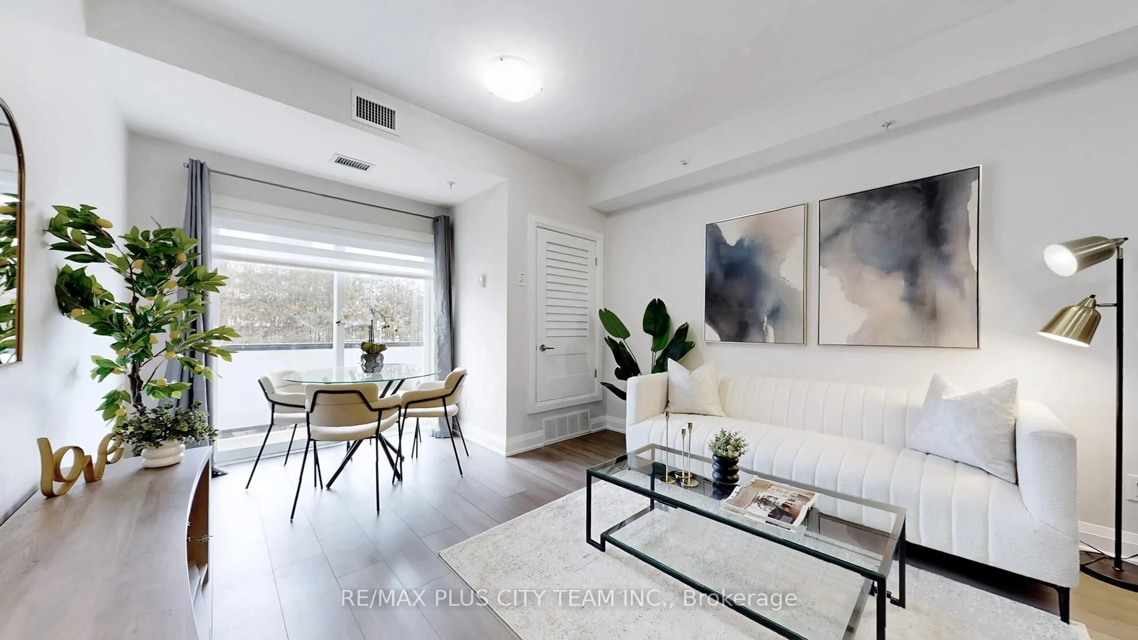 Living room with furniture, wood/laminate floor for 481 Rupert Ave #120, Whitchurch-Stouffville Ontario L4A 1Y7