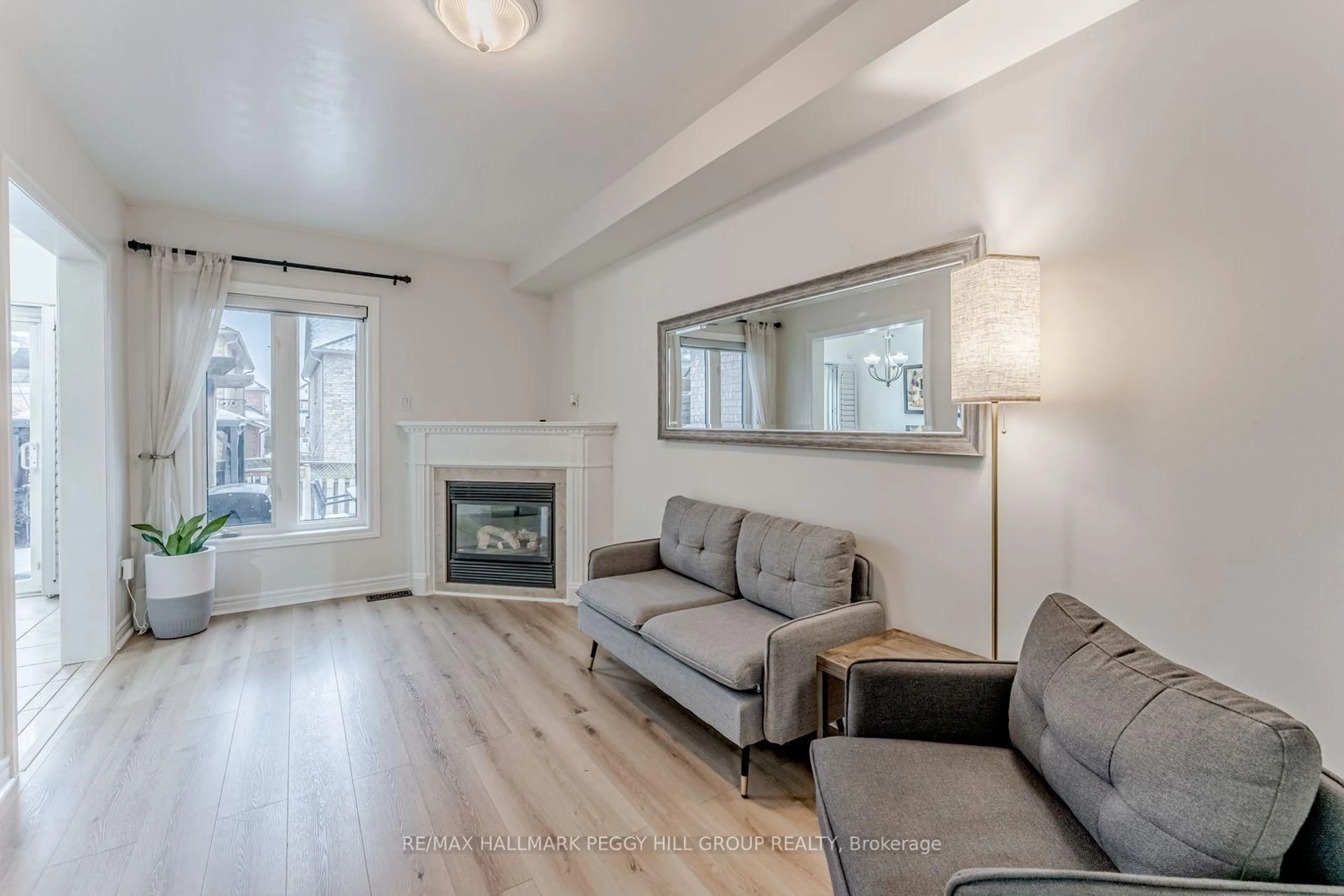 Living room with furniture, wood/laminate floor for 179 Warwick Cres, Newmarket Ontario L3X 2S3