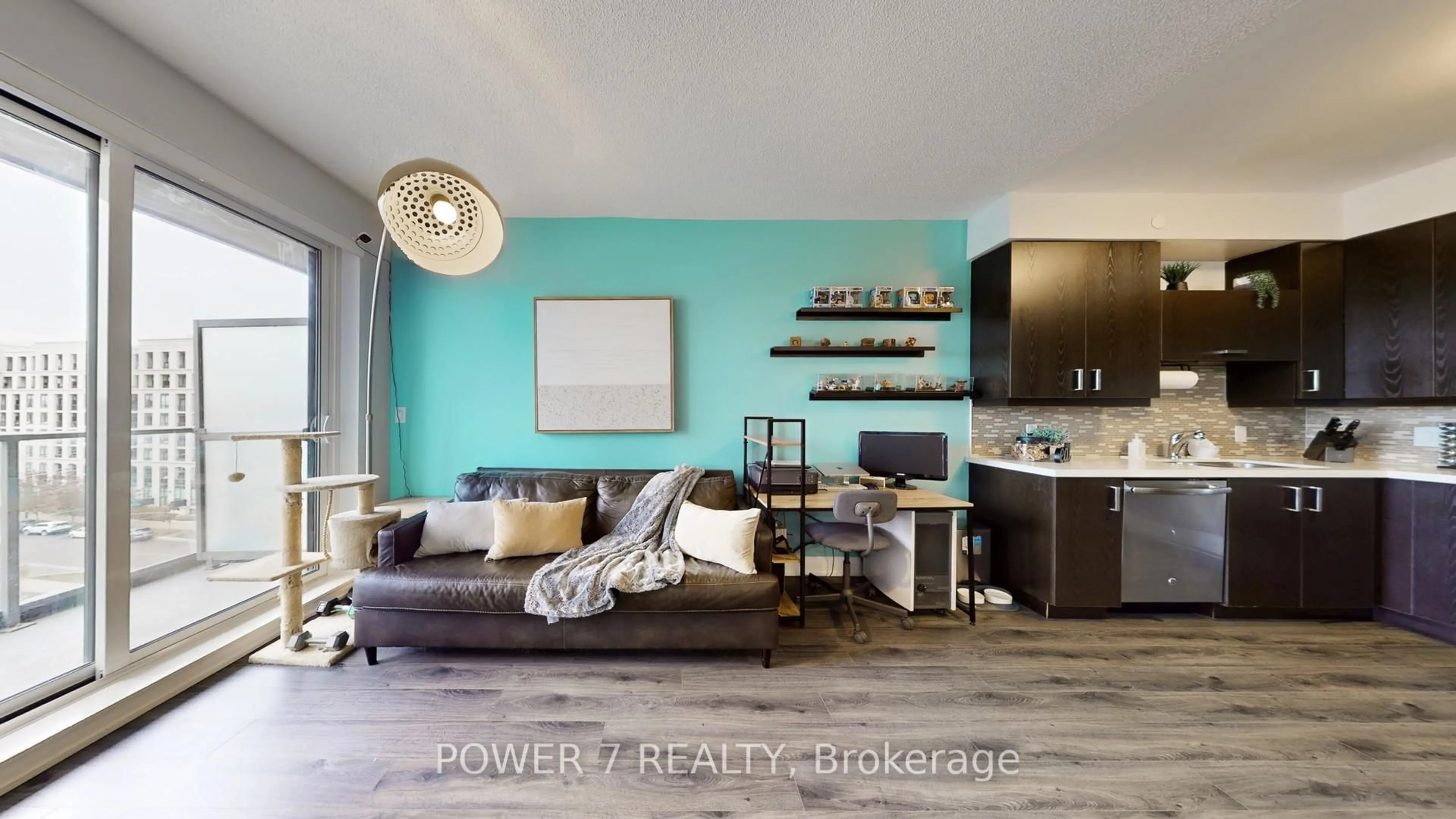 Living room with furniture, wood/laminate floor for 28 Uptown Dr #718, Markham Ontario L3R 5M8